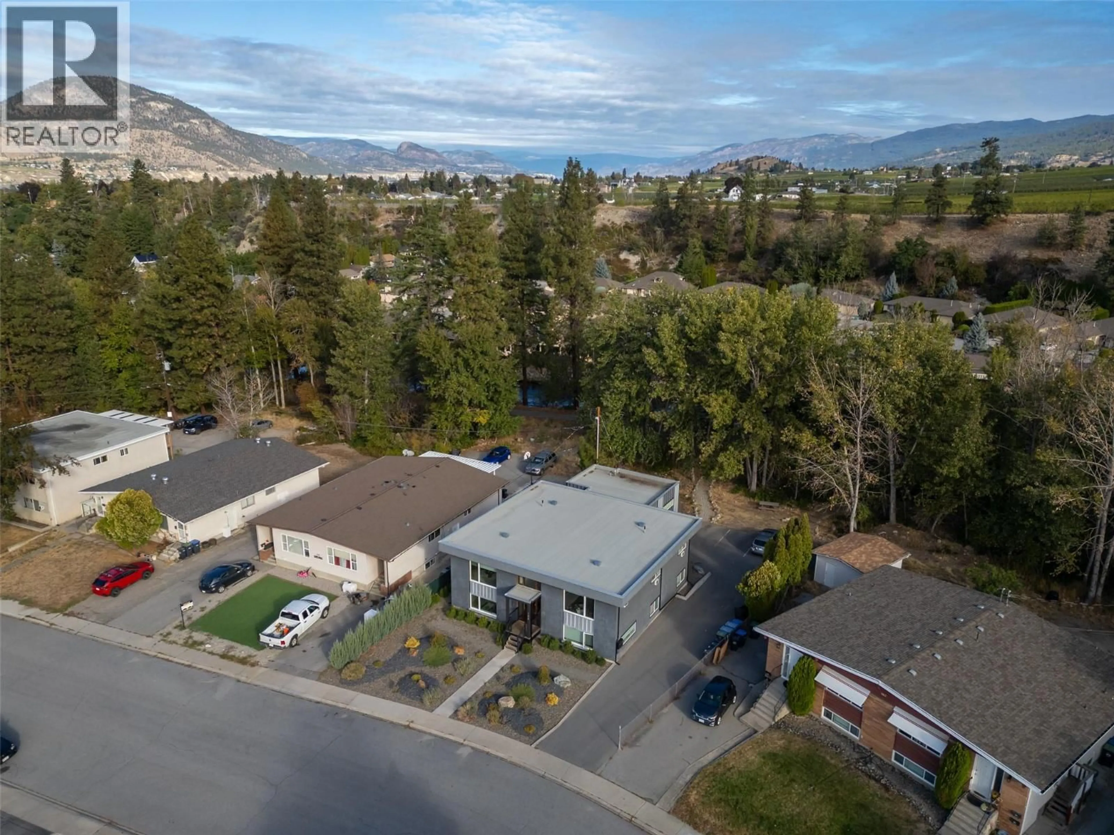 A pic from outside/outdoor area/front of a property/back of a property/a pic from drone, mountain view for 166 MCPHERSON CRESCENT, Penticton British Columbia V2A2N8