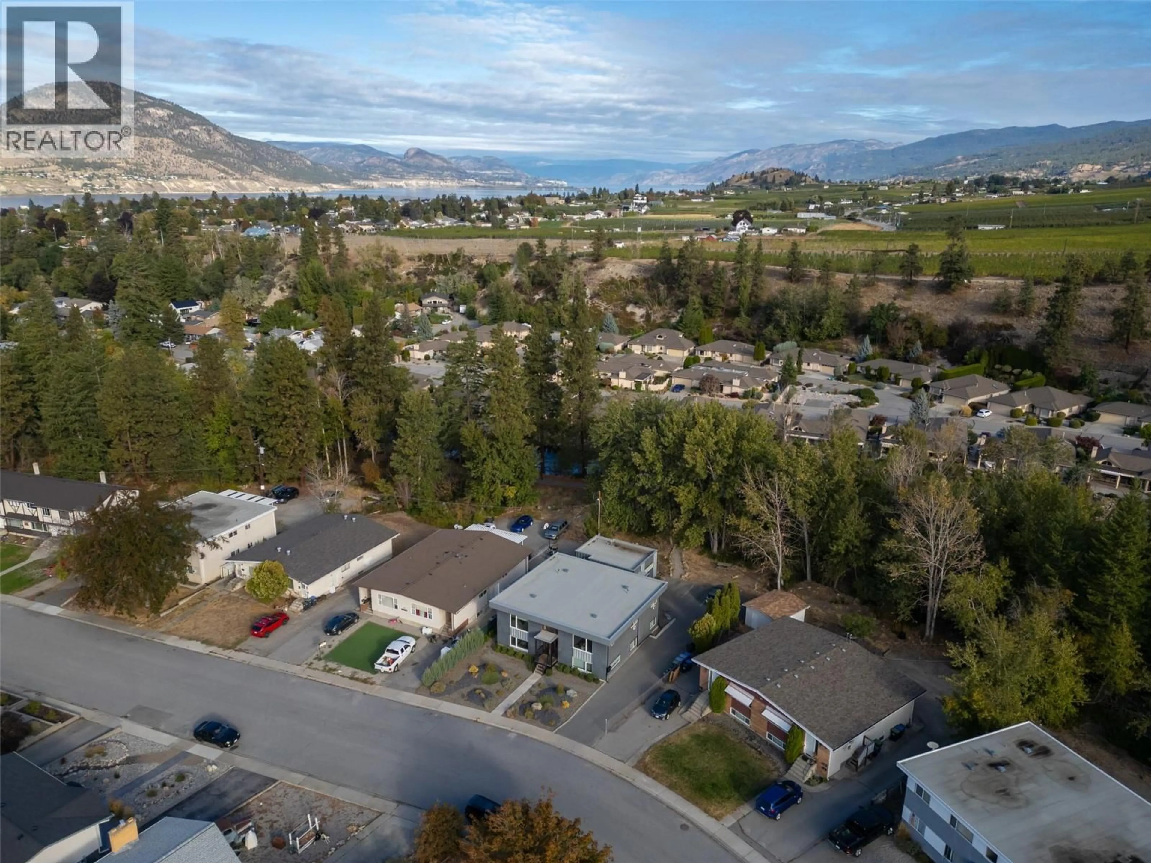 A pic from outside/outdoor area/front of a property/back of a property/a pic from drone, mountain view for 166 MCPHERSON CRESCENT, Penticton British Columbia V2A2N8