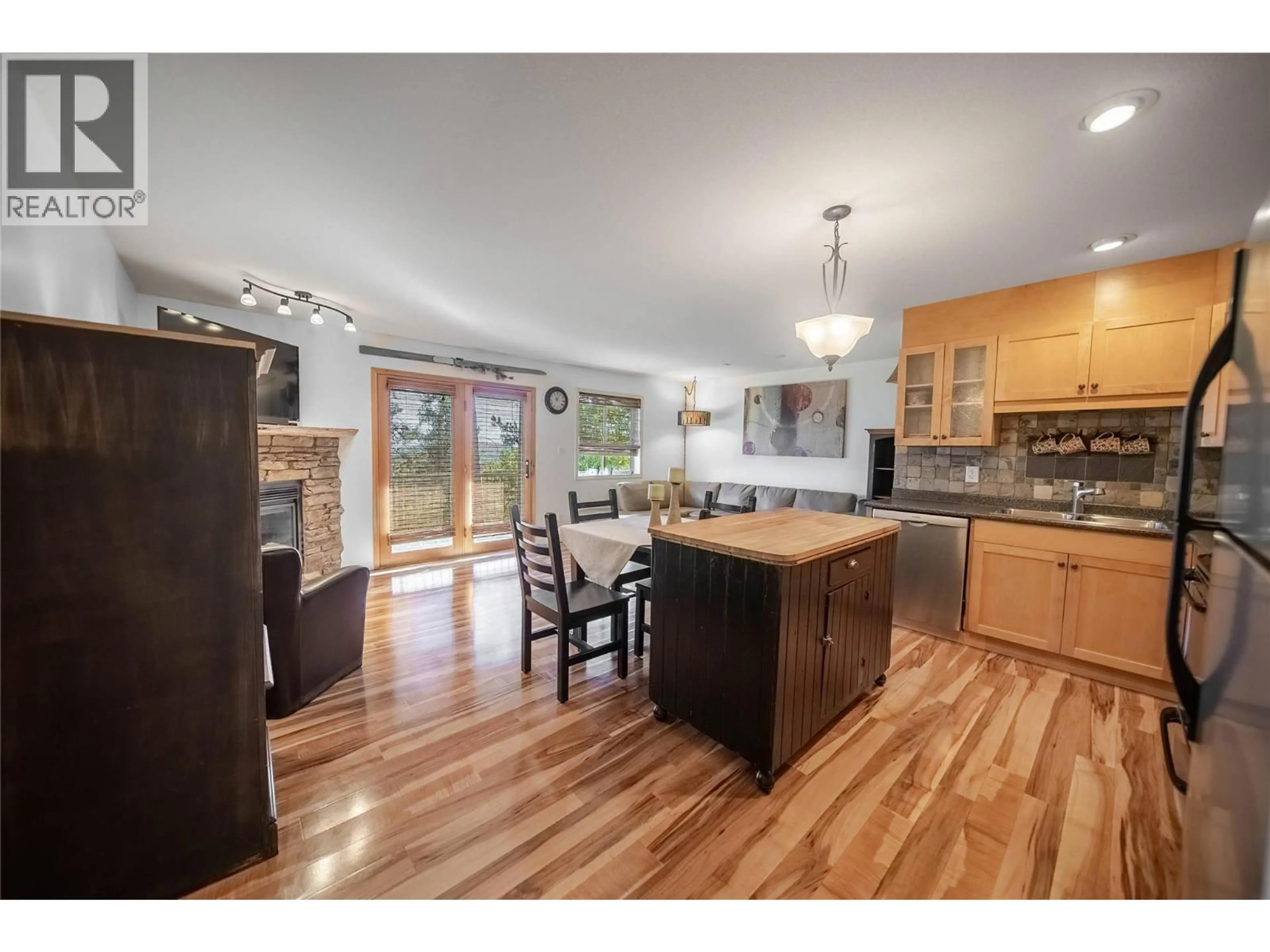 Open concept kitchen, wood/laminate floor for 303 - 910 DOGWOOD DRIVE, Kimberley British Columbia V1A2Y5