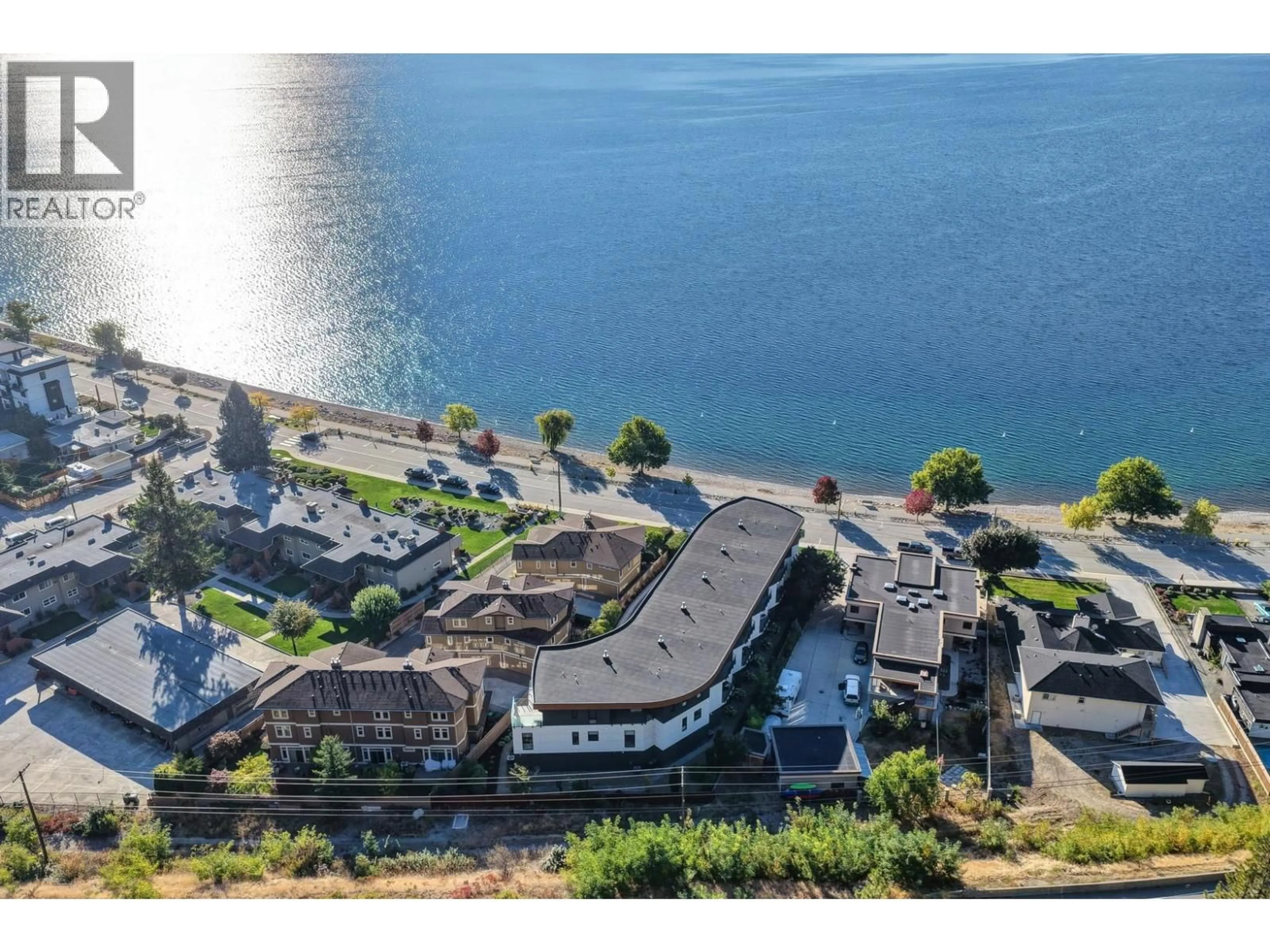 A pic from outside/outdoor area/front of a property/back of a property/a pic from drone, water/lake/river/ocean view for 1 - 4364 BEACH AVENUE, Peachland British Columbia V0H1X6