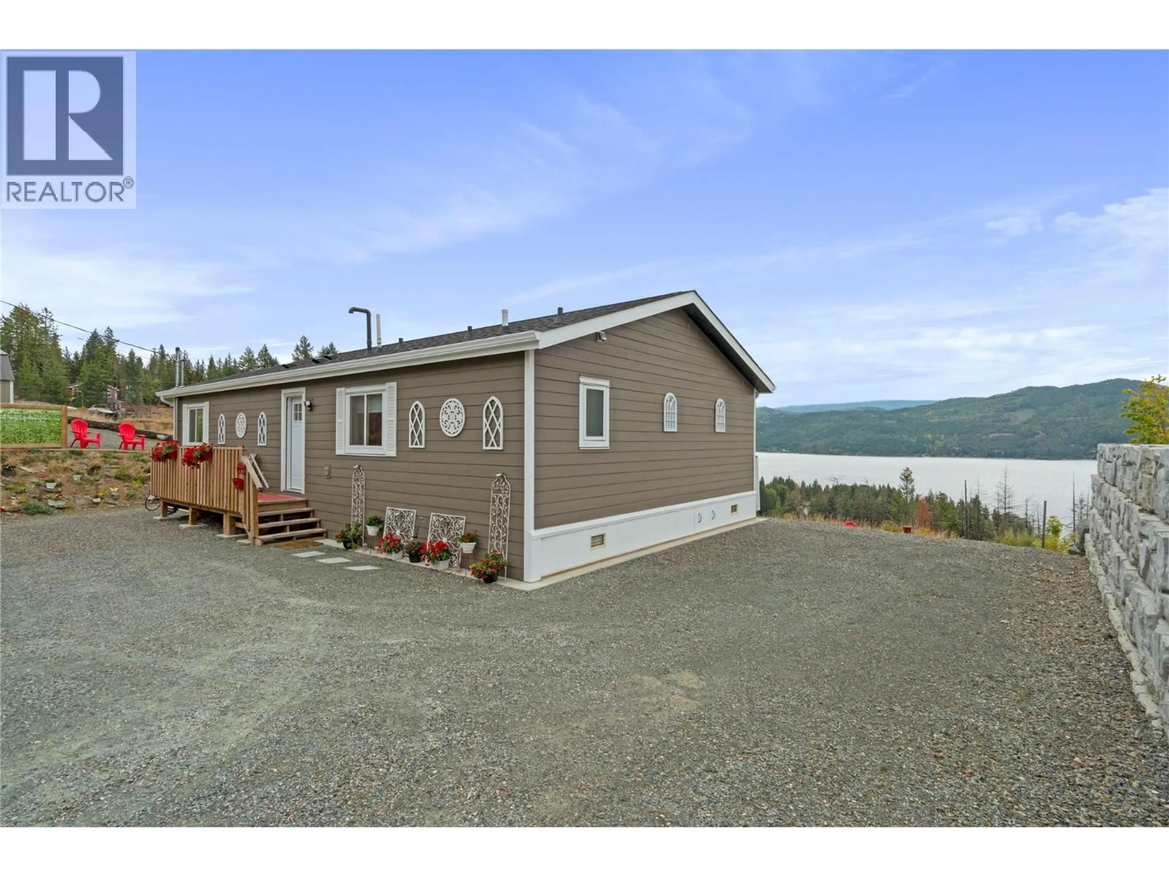 Home with vinyl exterior material, water/lake/river/ocean view for 5208 CELISTA PLACE, Celista British Columbia V0E1M6
