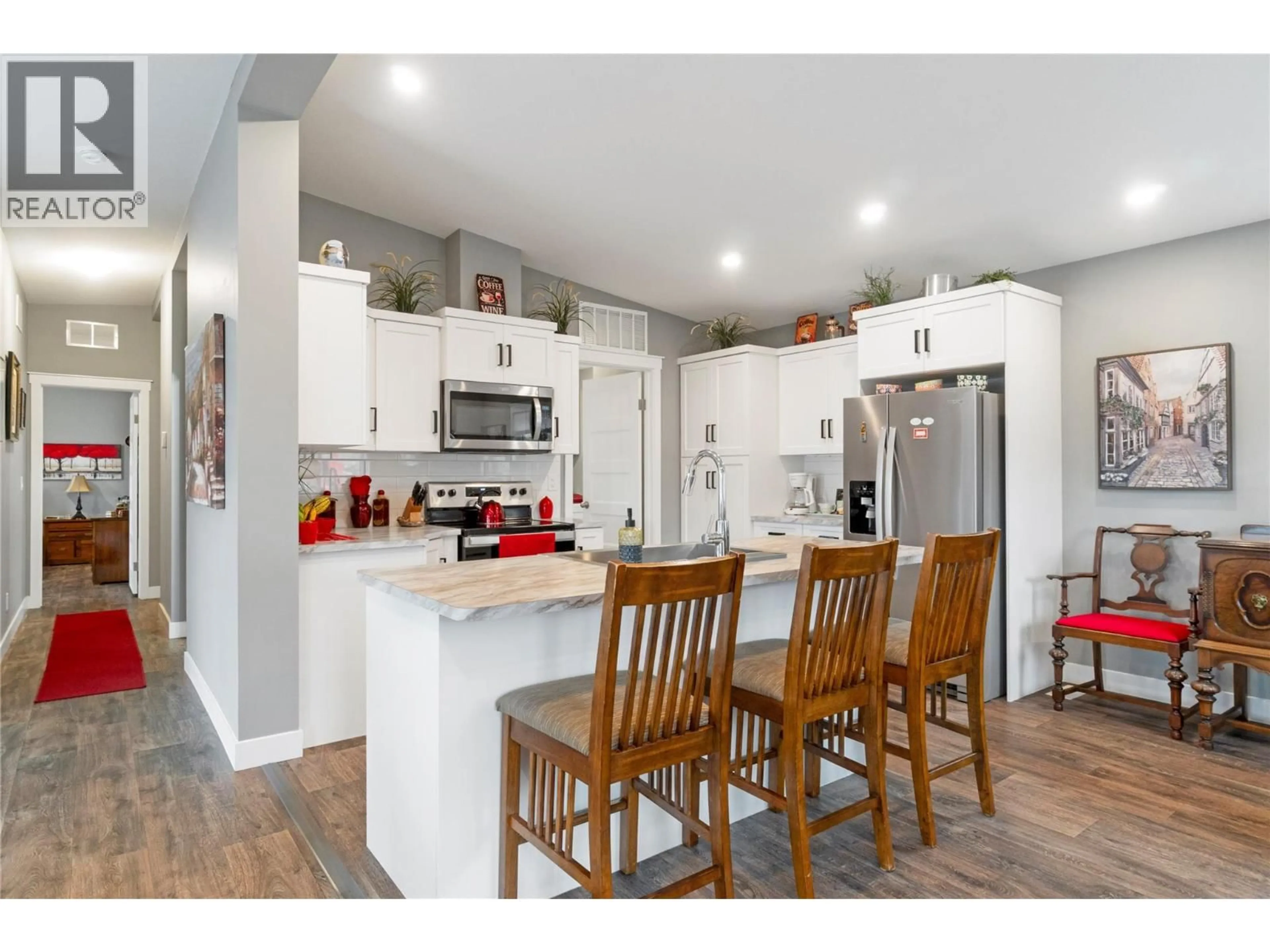 Open concept kitchen, wood/laminate floor for 5208 CELISTA PLACE, Celista British Columbia V0E1M6