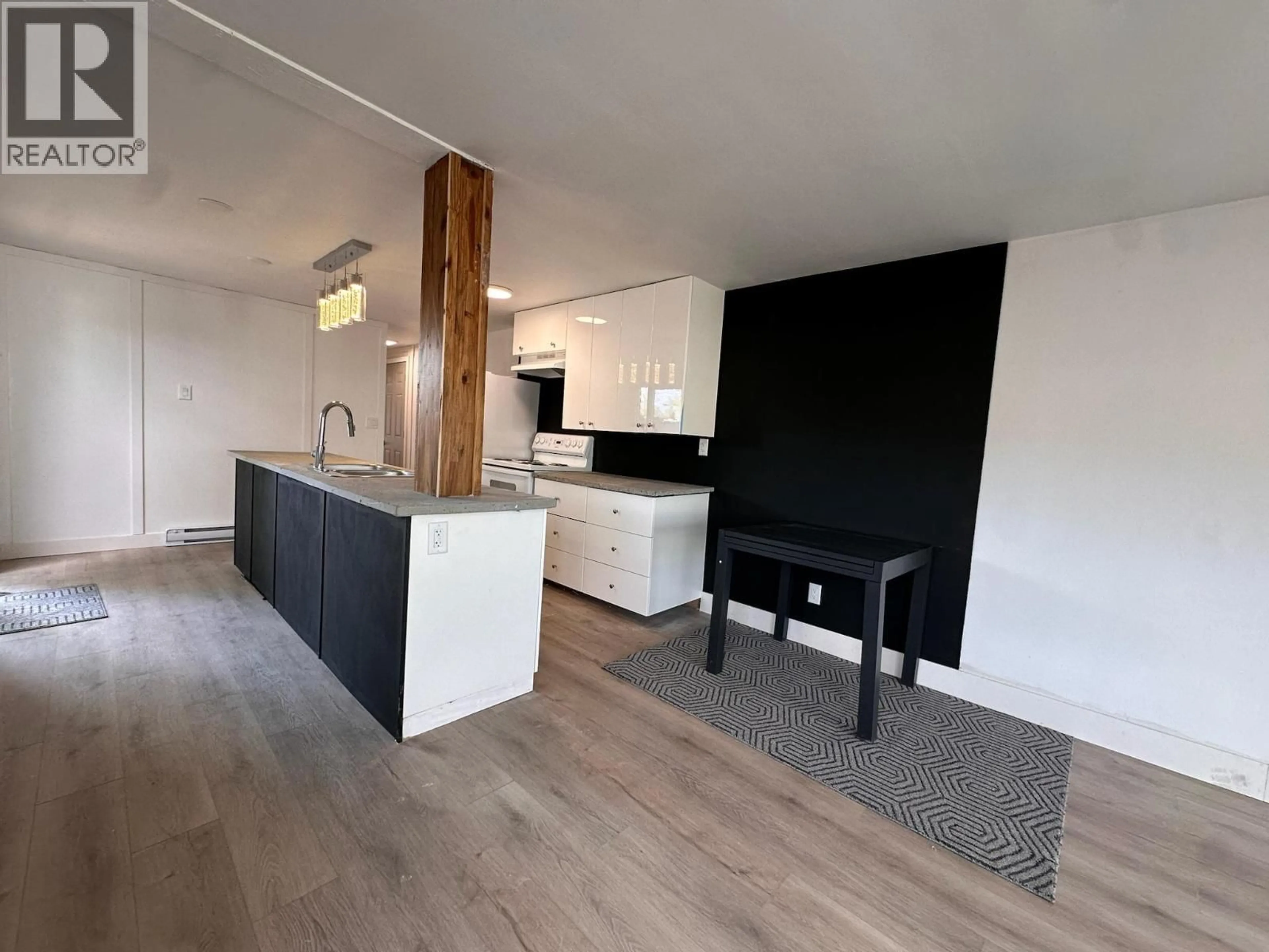 Open concept kitchen, wood/laminate floor for 34 - 3999 SKAHA LAKE ROAD, Penticton British Columbia V2A6J7