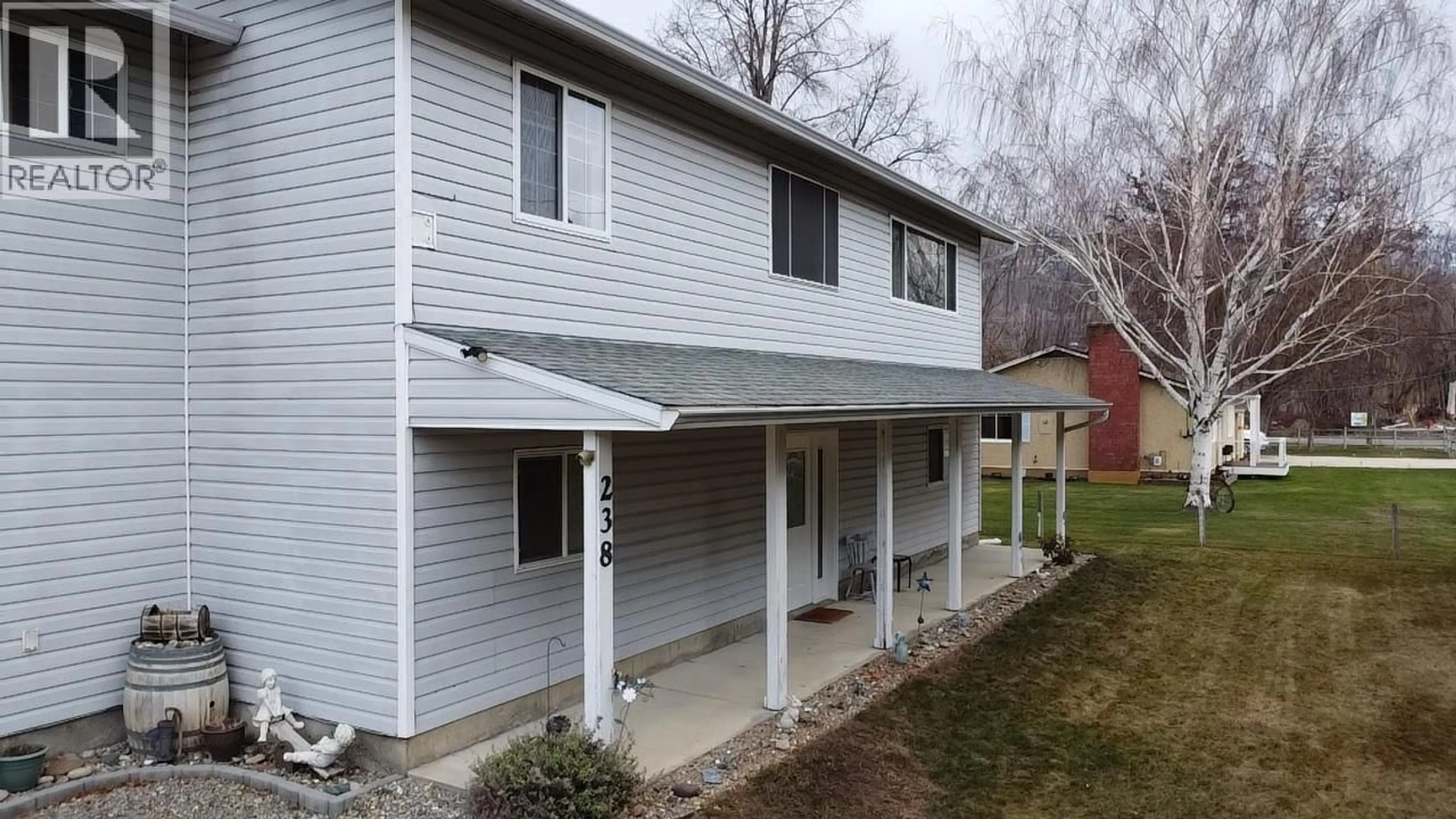 Home with vinyl exterior material, street for 238 PARK RILL ROAD, Oliver British Columbia V0H1T7