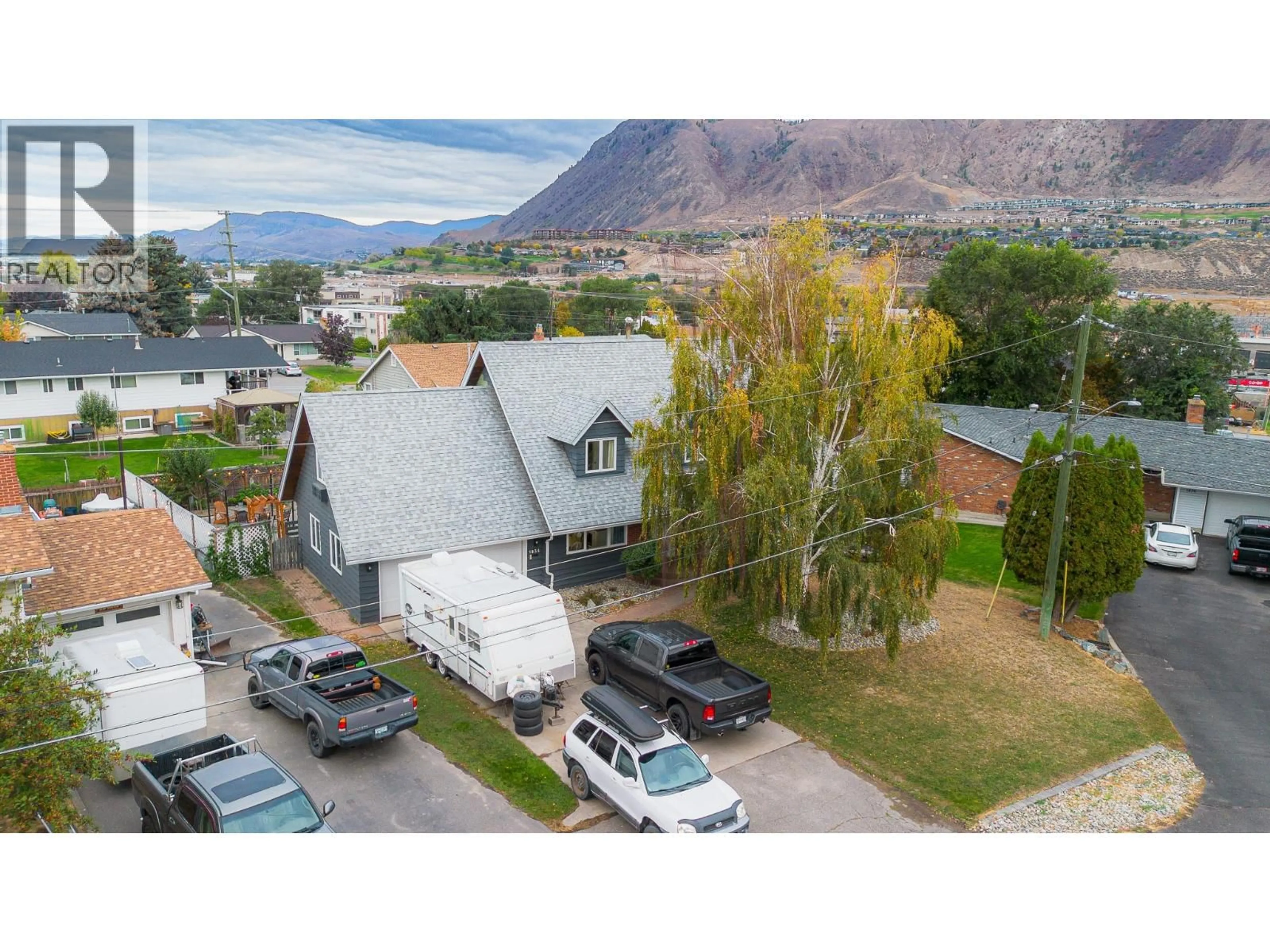 A pic from outside/outdoor area/front of a property/back of a property/a pic from drone, mountain view for 1834 RUSSET WYND, Kamloops British Columbia V2C4N5