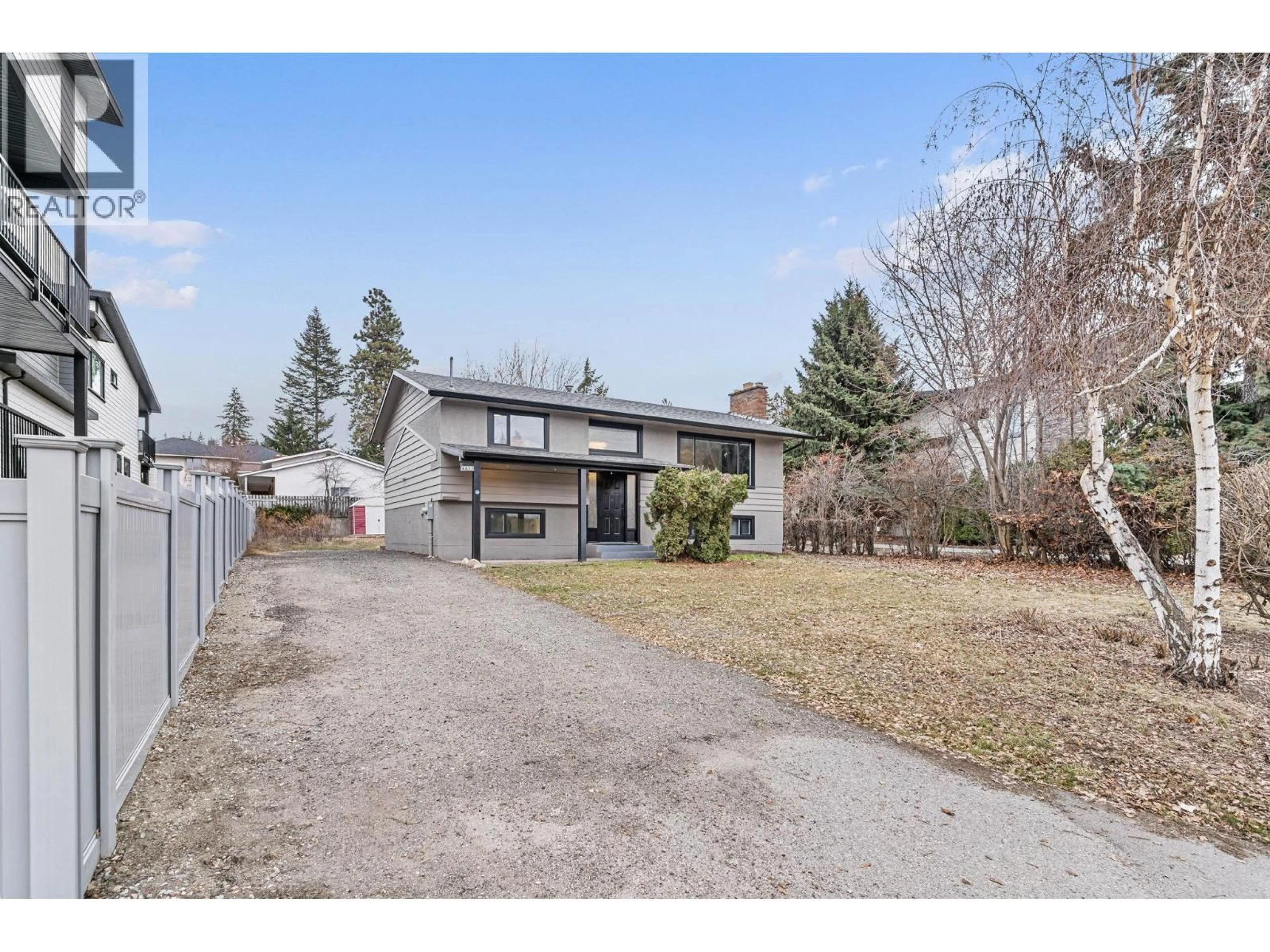 A pic from outside/outdoor area/front of a property/back of a property/a pic from drone, street for 4611 GORDON DRIVE, Kelowna British Columbia V1W1T5