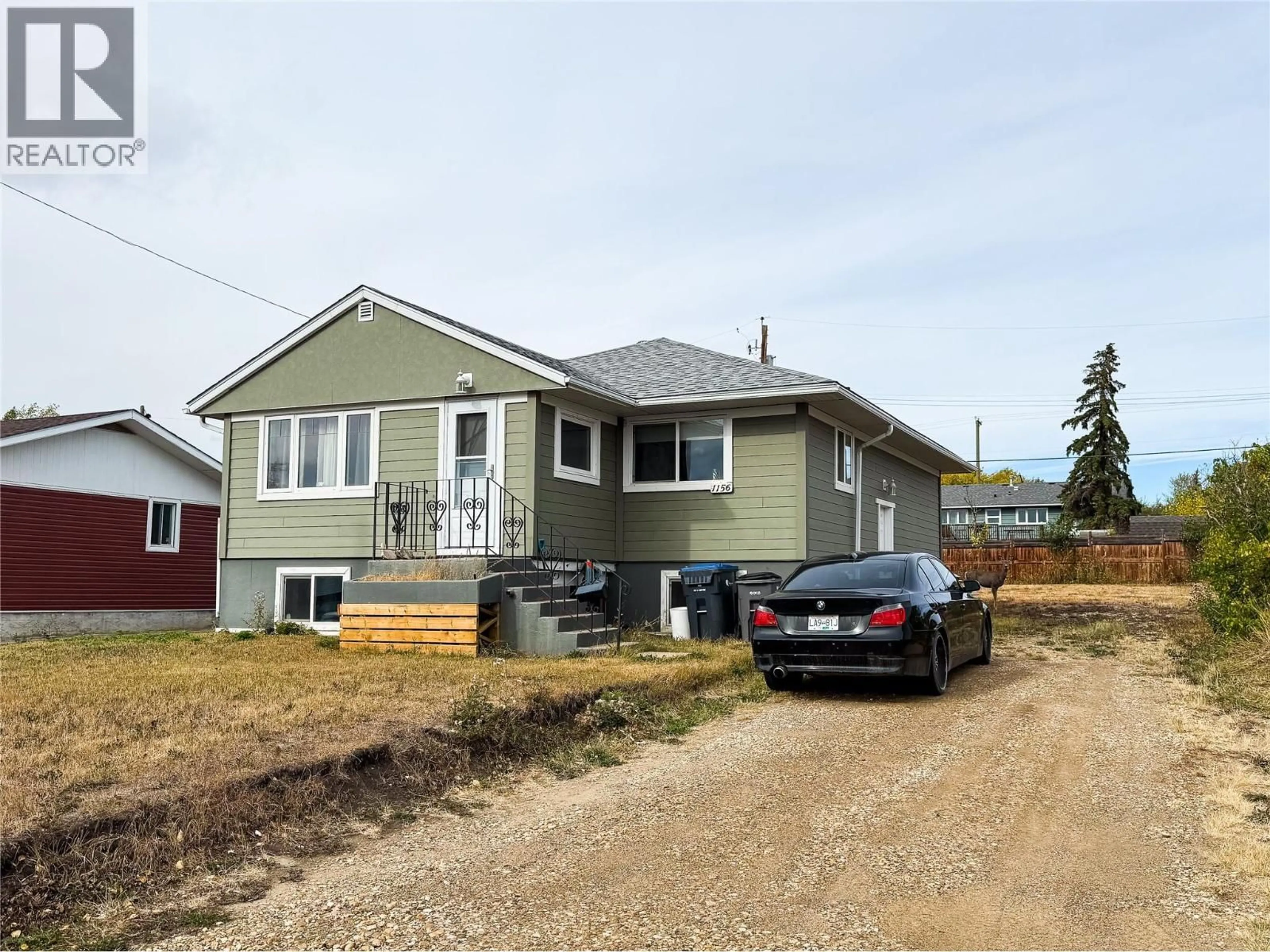 Home with vinyl exterior material, street for 1156 96A AVENUE, Dawson Creek British Columbia V1G1M8