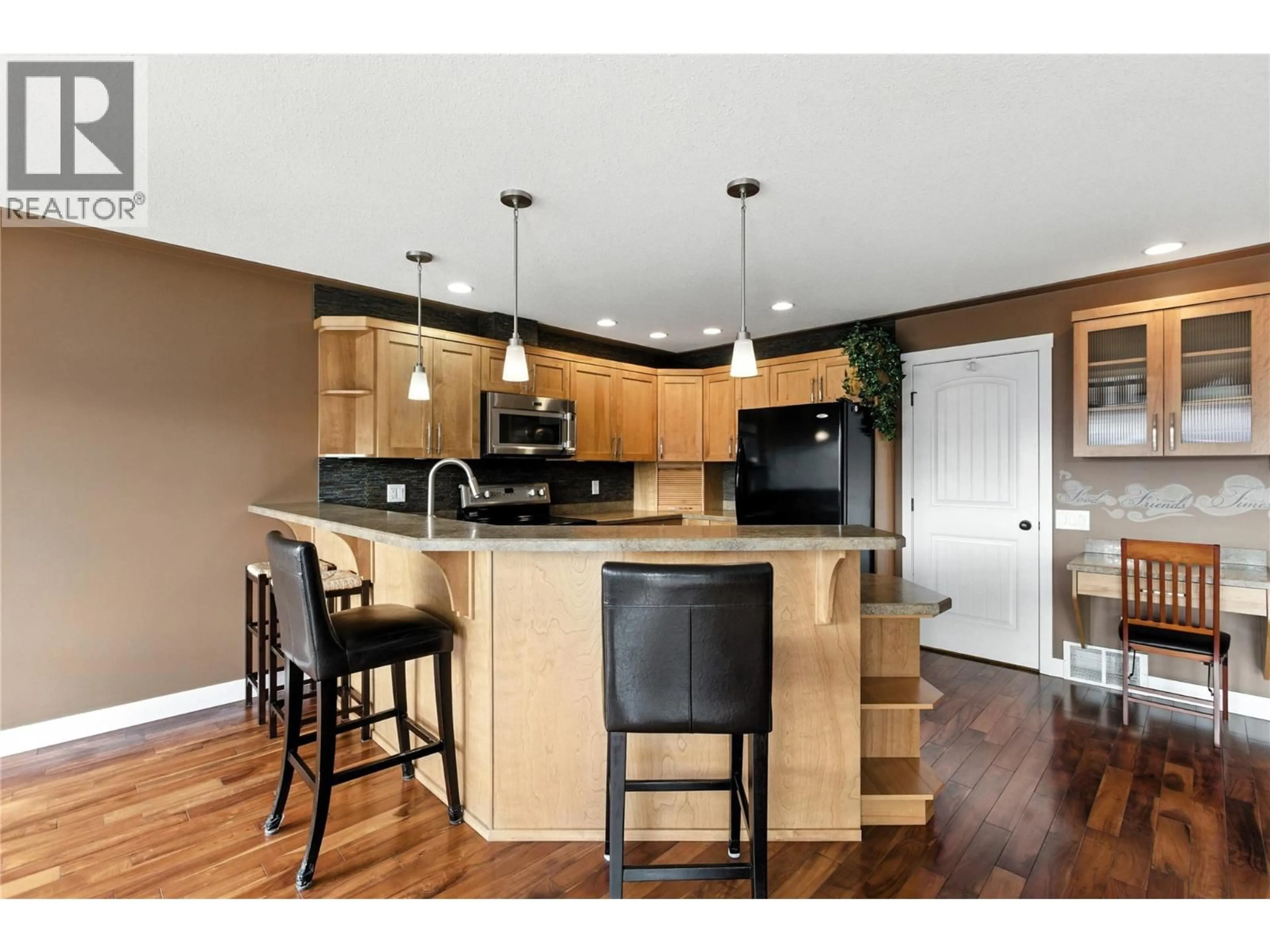 Open concept kitchen, wood/laminate floor for 12 - 1885 GRASSLANDS BOULEVARD, Kamloops British Columbia V2B0B8