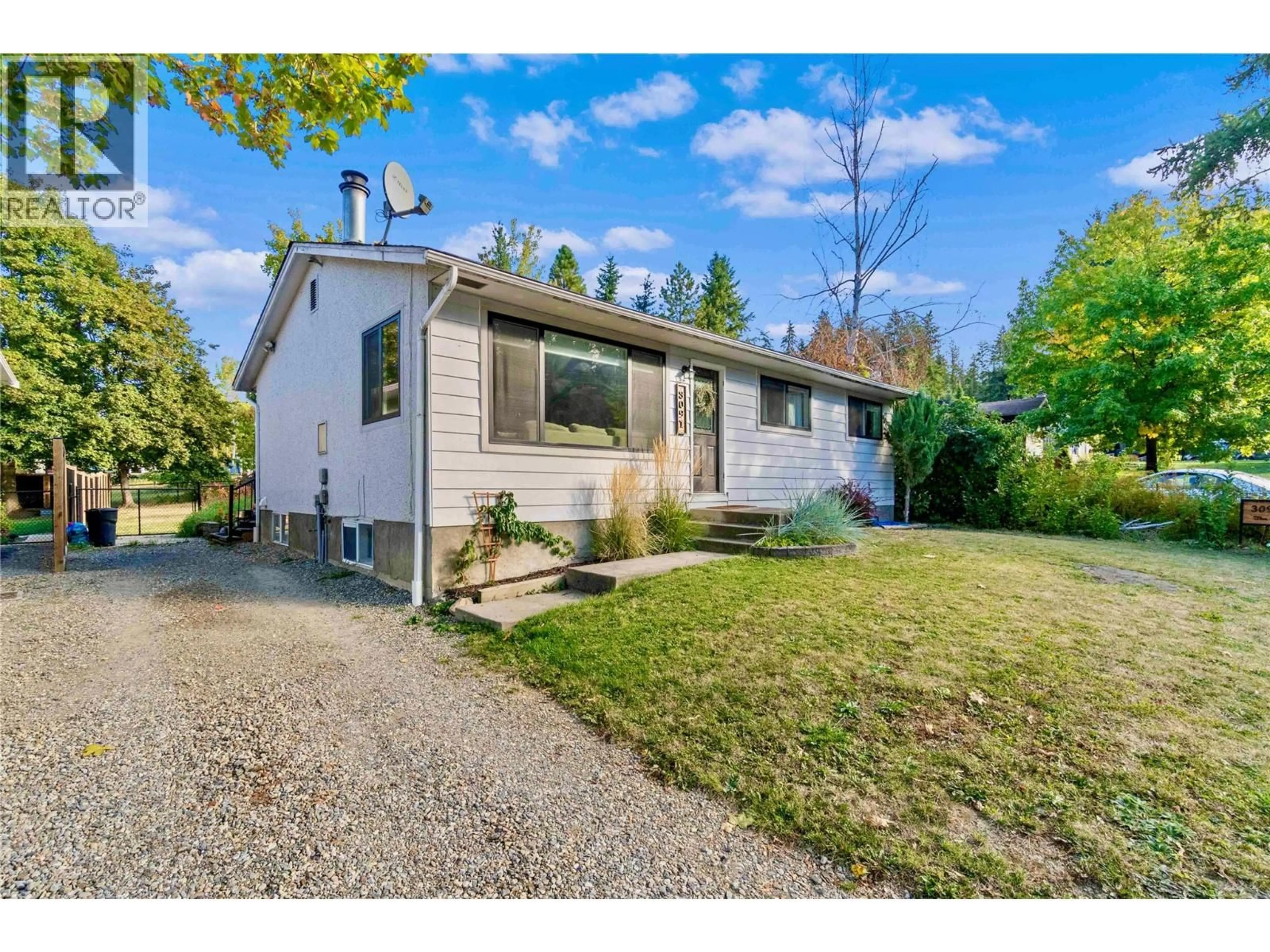 A pic from outside/outdoor area/front of a property/back of a property/a pic from drone, street for 3091 28 AVENUE NORTHEAST, Salmon Arm British Columbia V1E3G2