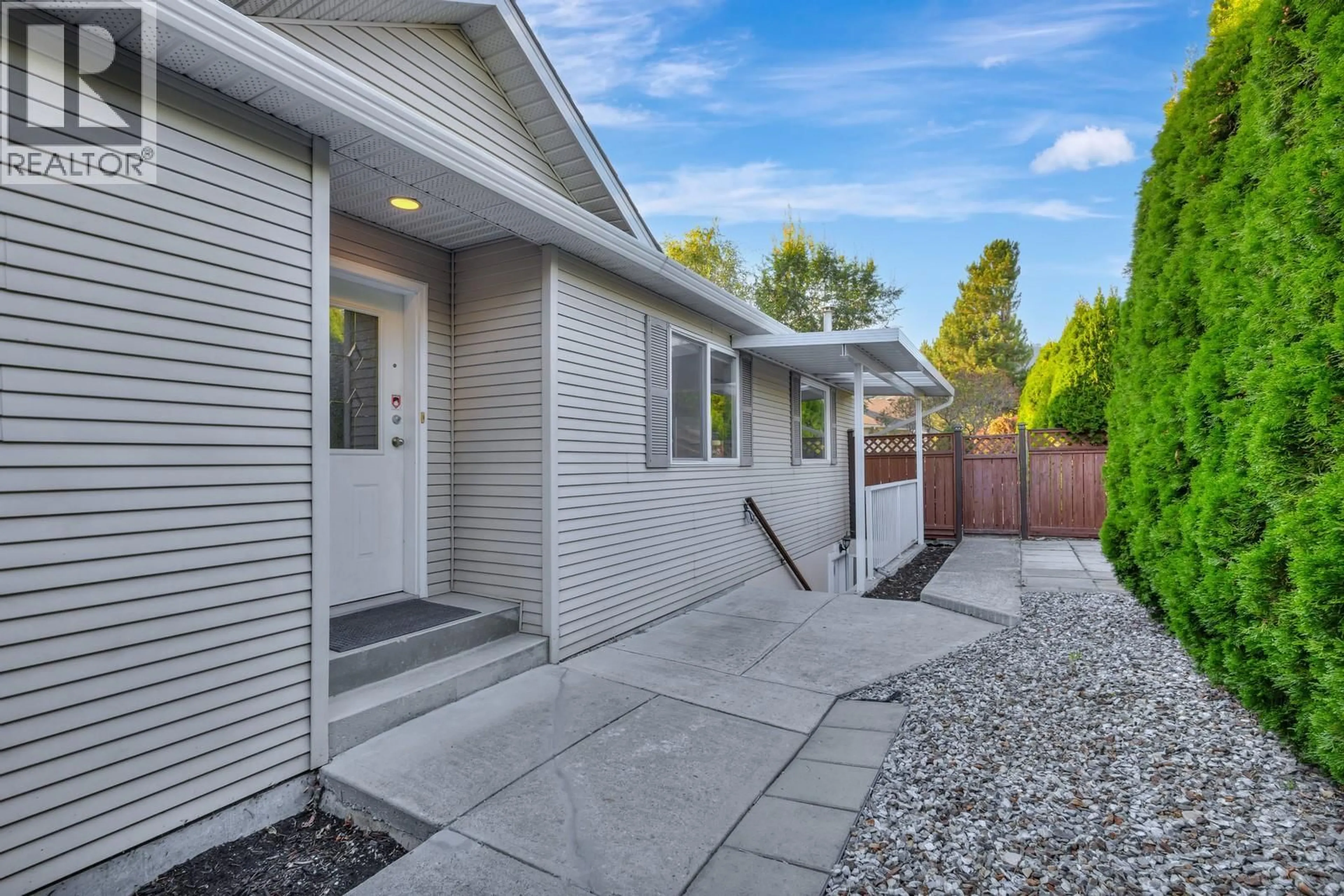 Home with brick exterior material, street for 100 VERNA COURT, Kelowna British Columbia V1V1S9