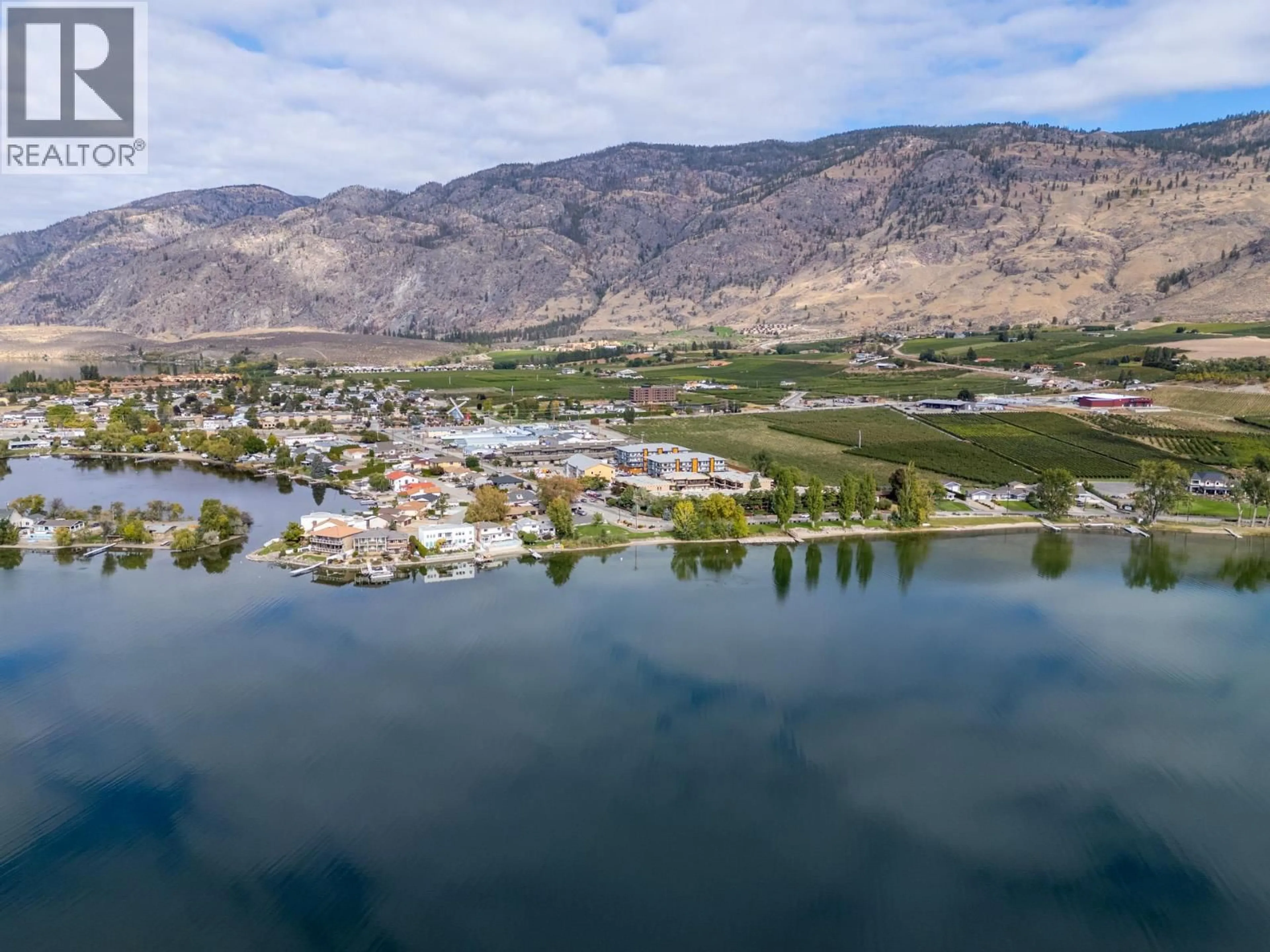 A pic from outside/outdoor area/front of a property/back of a property/a pic from drone, water/lake/river/ocean view for 104 - 5401 LAKESHORE DRIVE, Osoyoos British Columbia V0H1V6