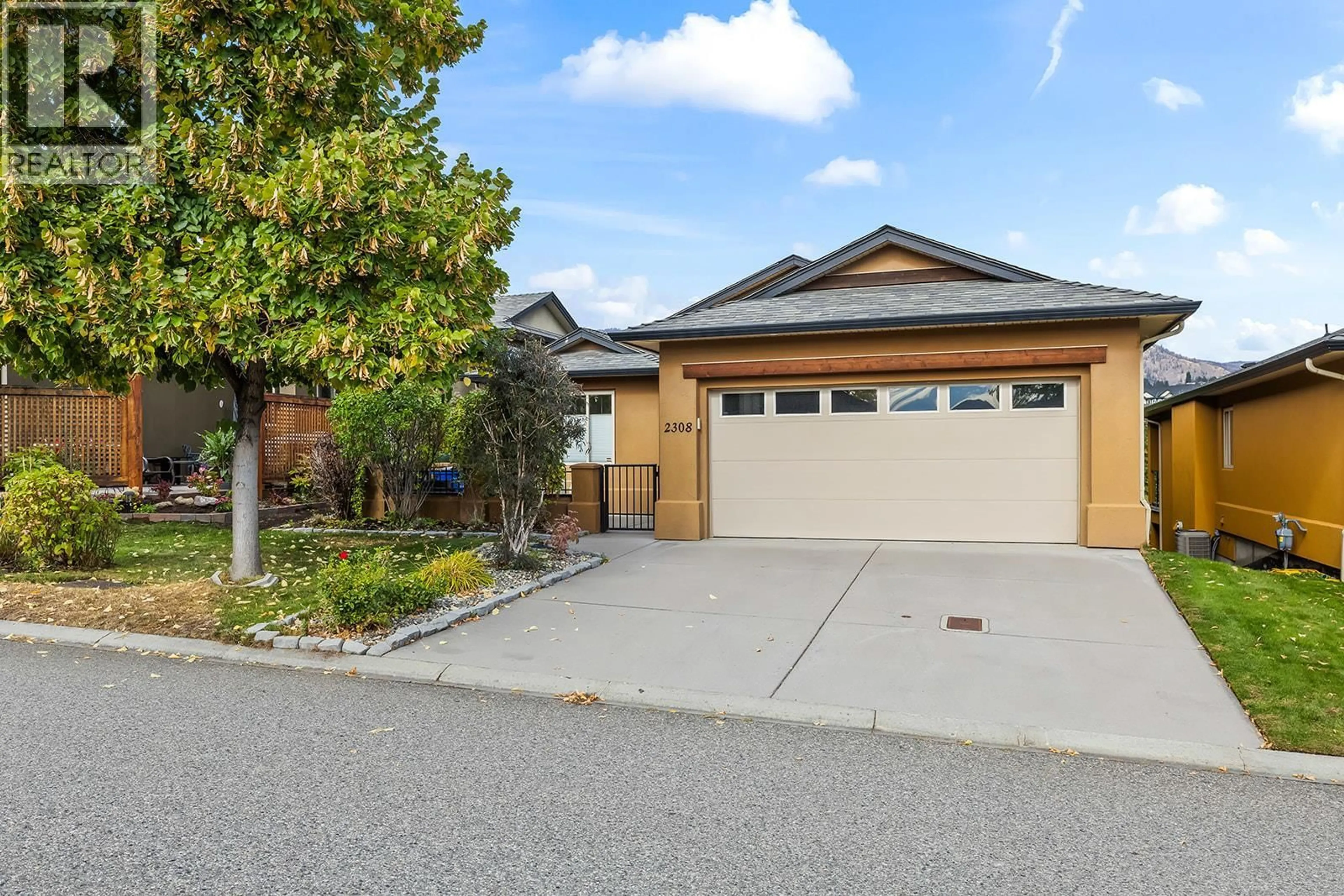 Home with vinyl exterior material, street for 2308 PINE VISTA PLACE, West Kelowna British Columbia V4T2Y1
