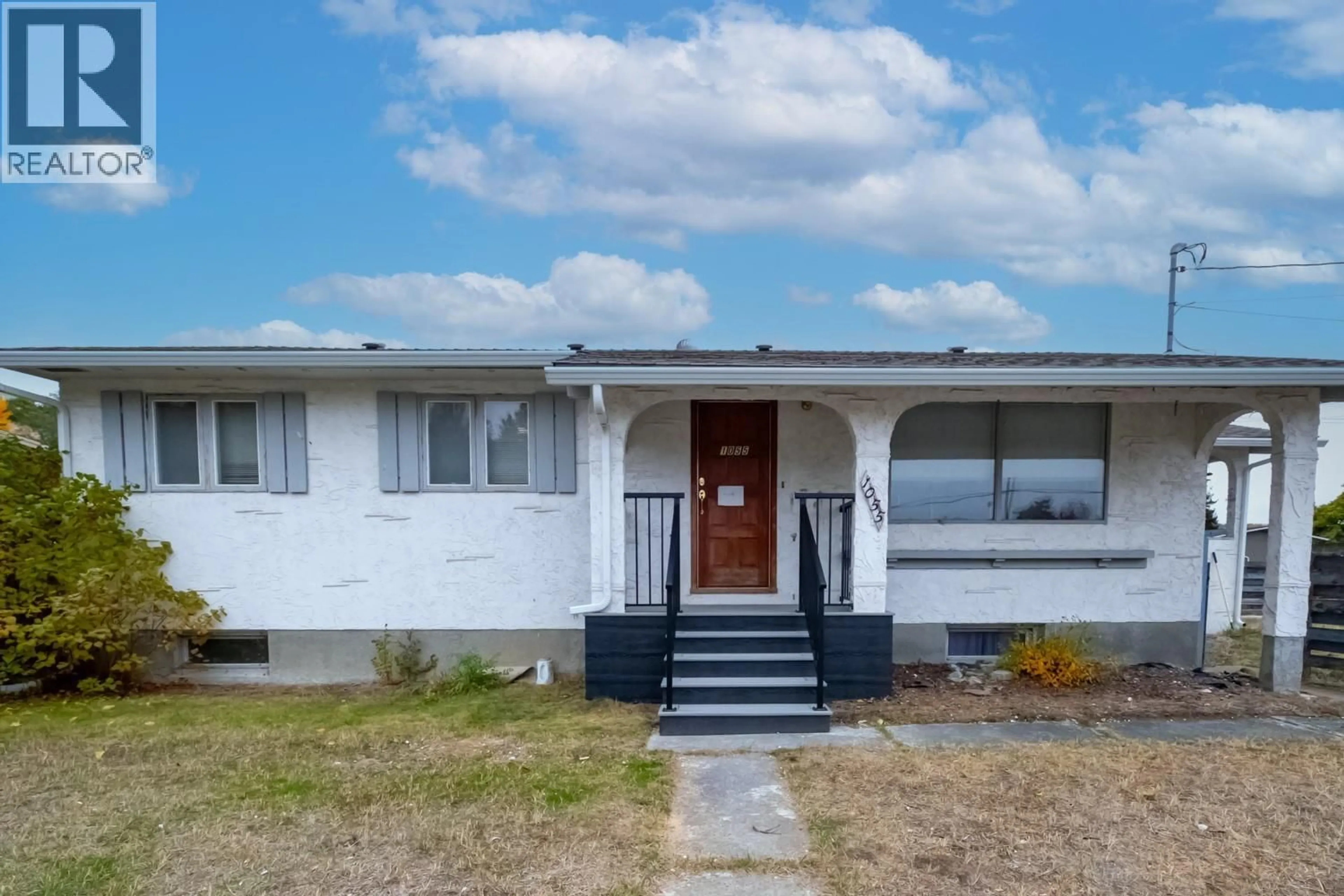 Home with vinyl exterior material, street for 1055 JASMINE ROAD, Kelowna British Columbia V1X3P2