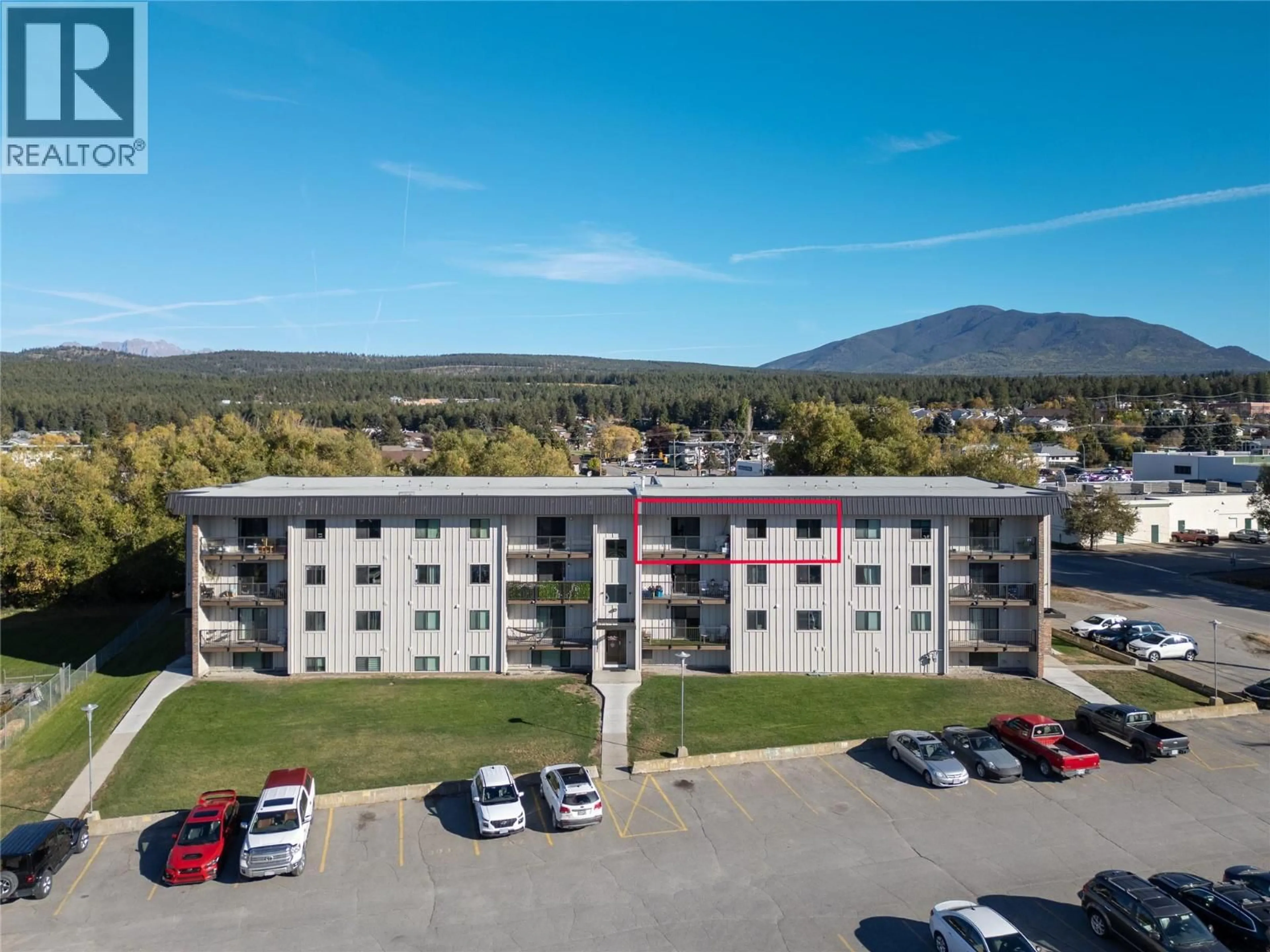 A pic from outside/outdoor area/front of a property/back of a property/a pic from drone, mountain view for 406 - 606 18TH  N AVENUE, Cranbrook British Columbia V1C5M1