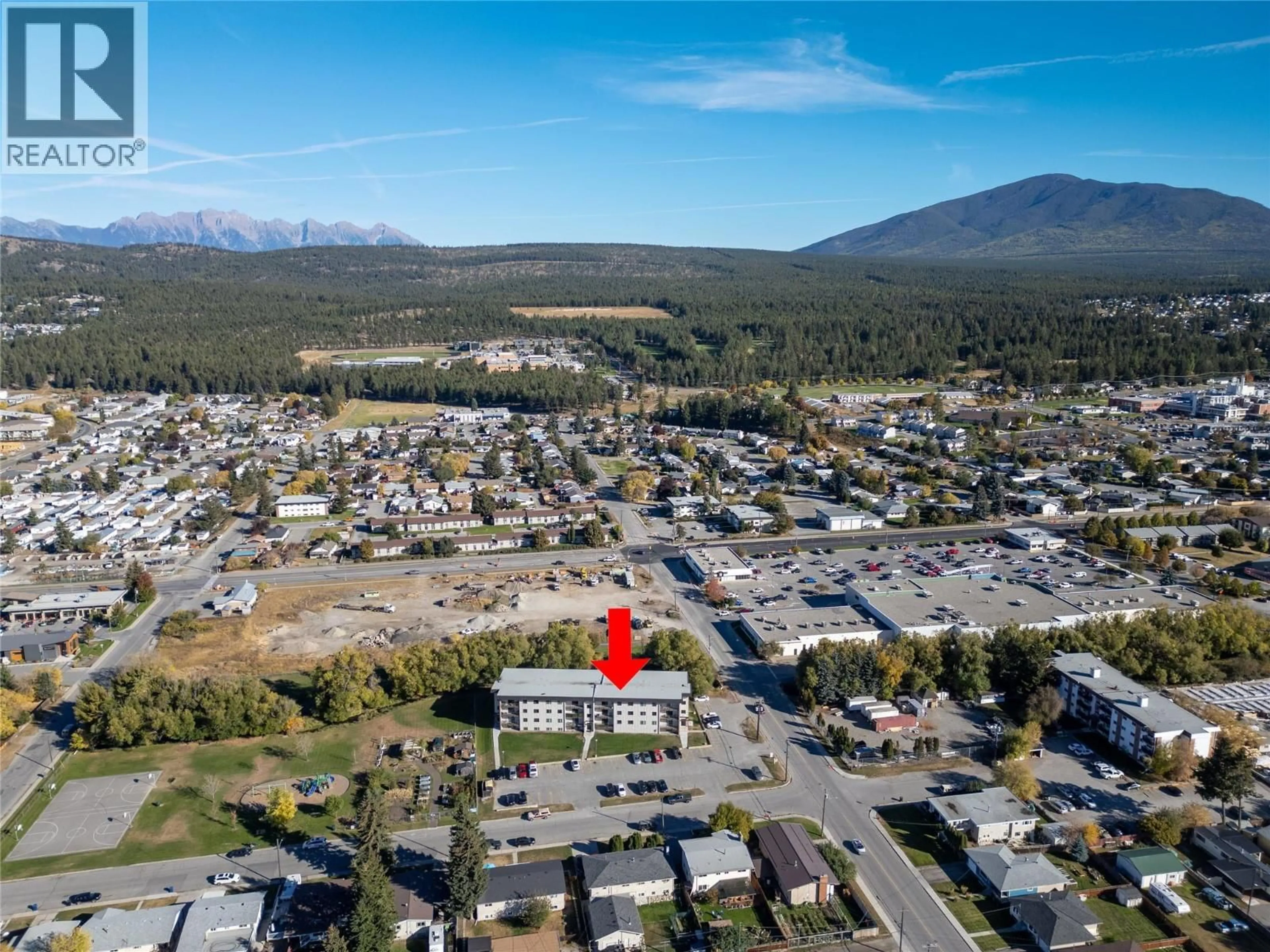 A pic from outside/outdoor area/front of a property/back of a property/a pic from drone, mountain view for 406 - 606 18TH  N AVENUE, Cranbrook British Columbia V1C5M1