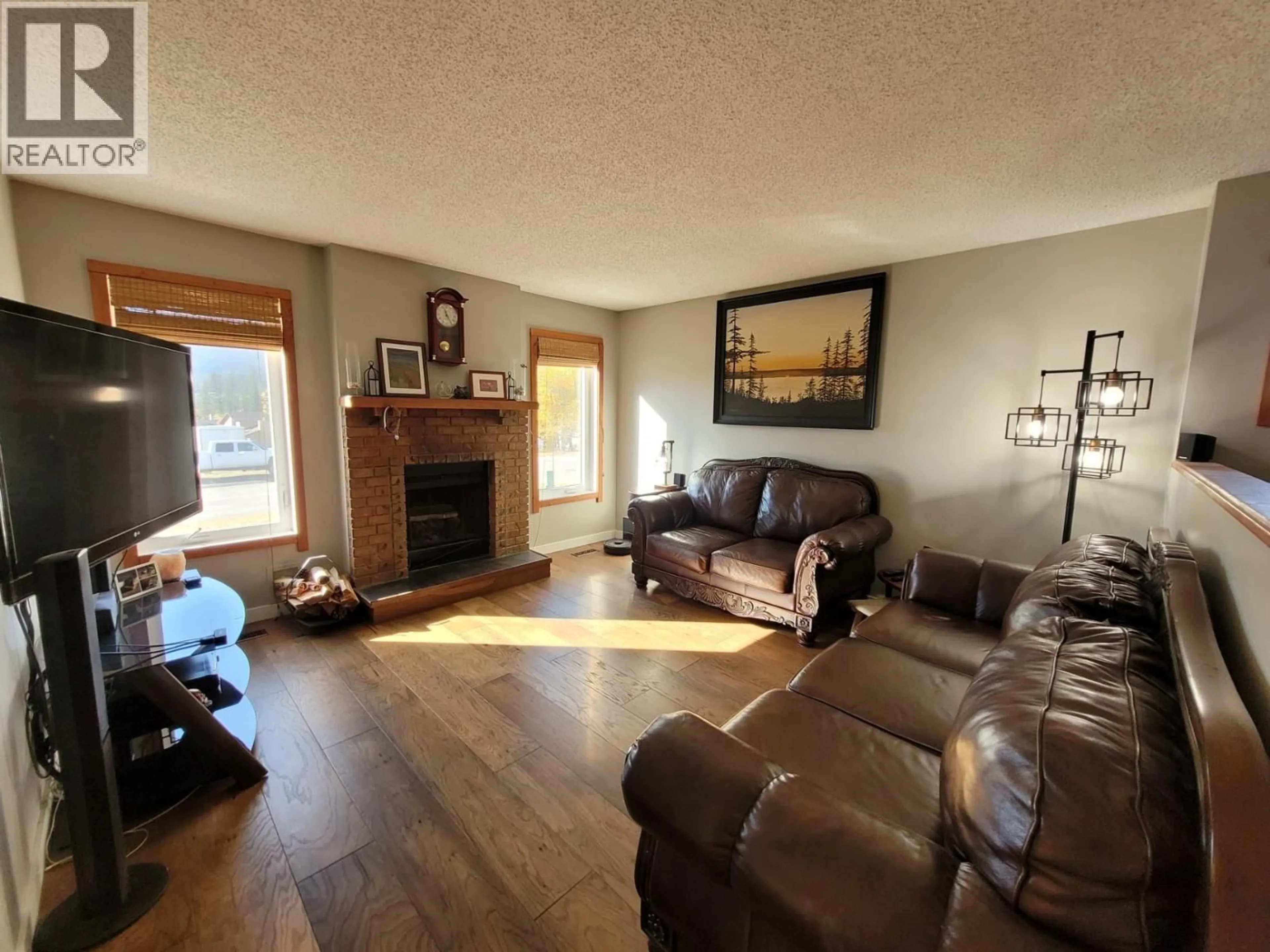 Living room with furniture, wood/laminate floor for 1 CLAREMONT PLACE, Elkford British Columbia V0B1H0