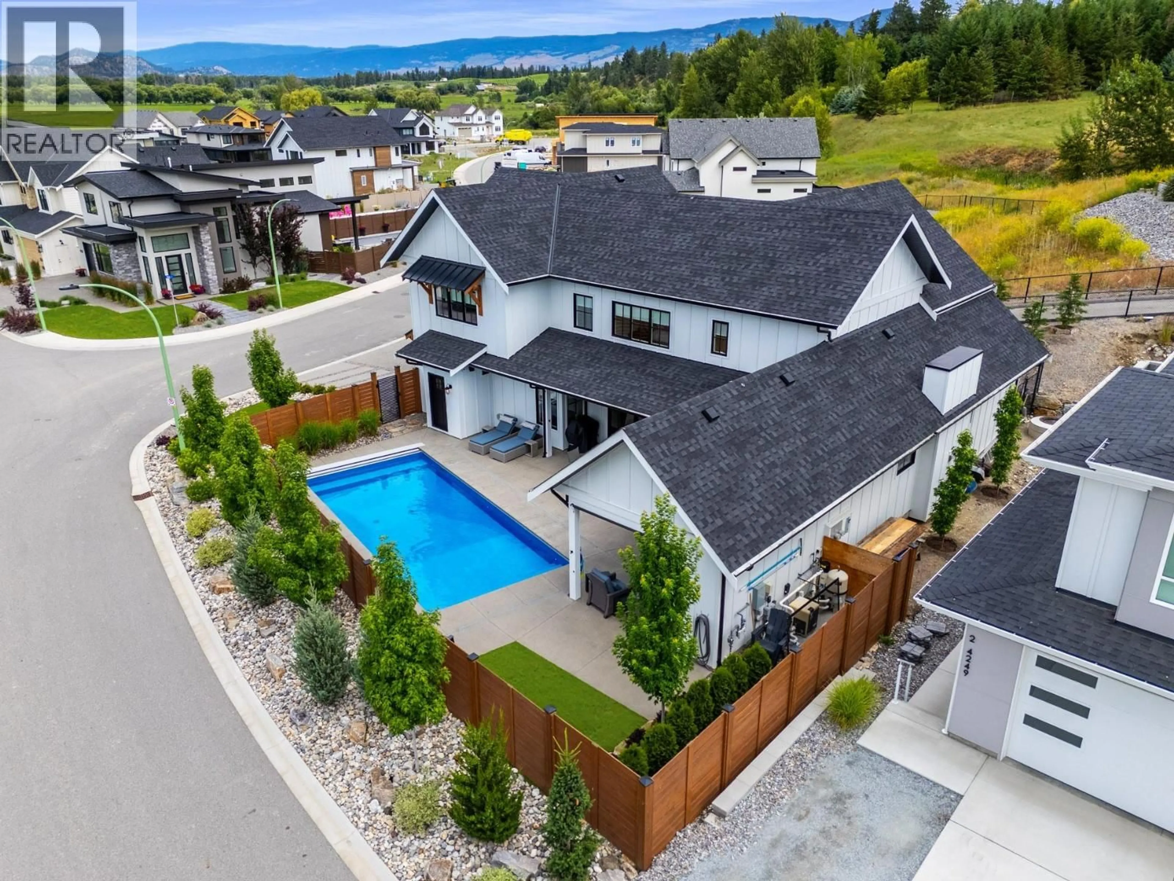A pic from outside/outdoor area/front of a property/back of a property/a pic from drone, mountain view for 4243 RUSSO STREET, Kelowna British Columbia V1W0C6