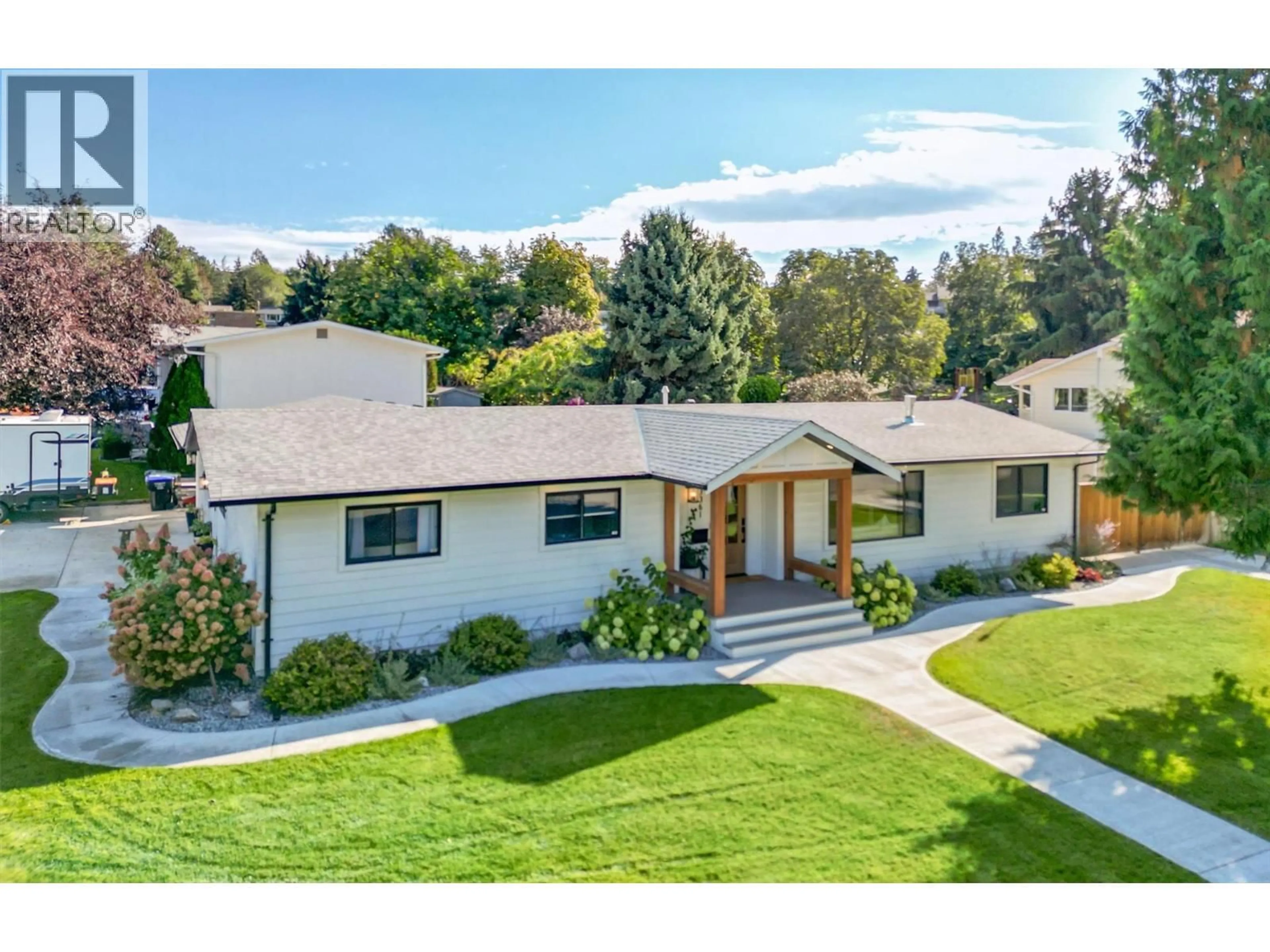 A pic from outside/outdoor area/front of a property/back of a property/a pic from drone, mountain view for 3361 HALL ROAD, Kelowna British Columbia V1W2V9