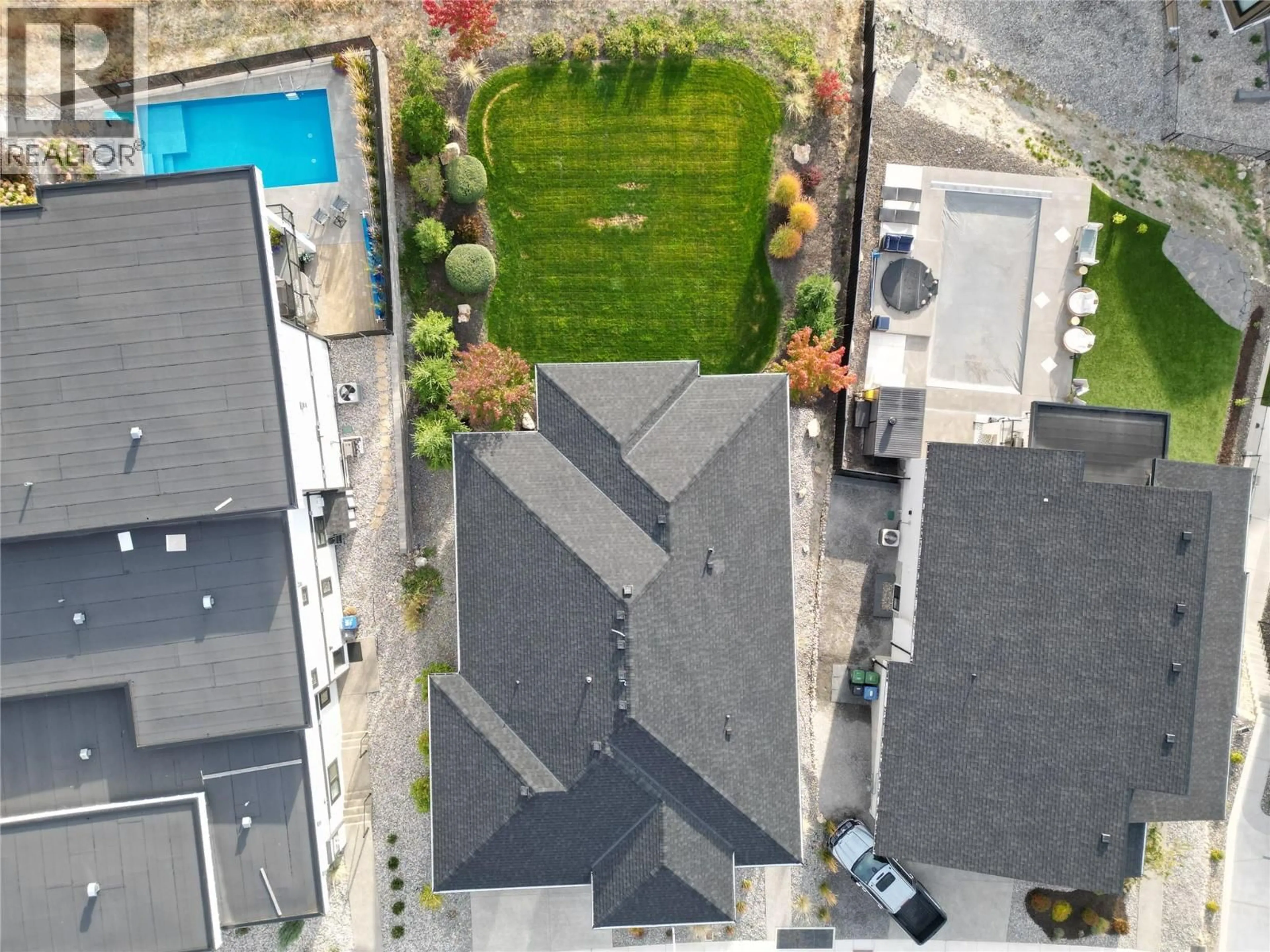 A pic from outside/outdoor area/front of a property/back of a property/a pic from drone, street for 1049 LOSETH DRIVE, Kelowna British Columbia V1P0A1