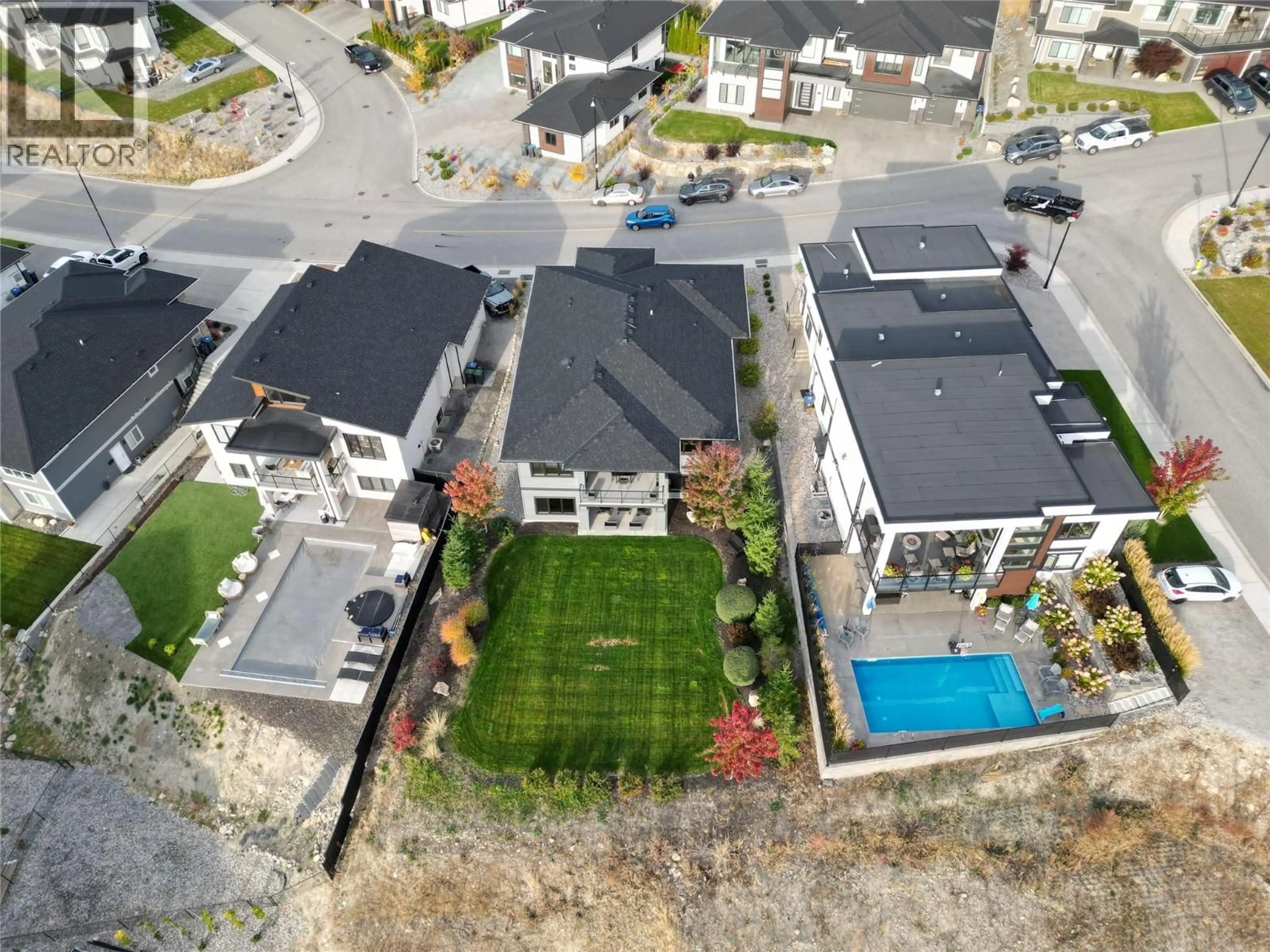 A pic from outside/outdoor area/front of a property/back of a property/a pic from drone, street for 1049 LOSETH DRIVE, Kelowna British Columbia V1P0A1