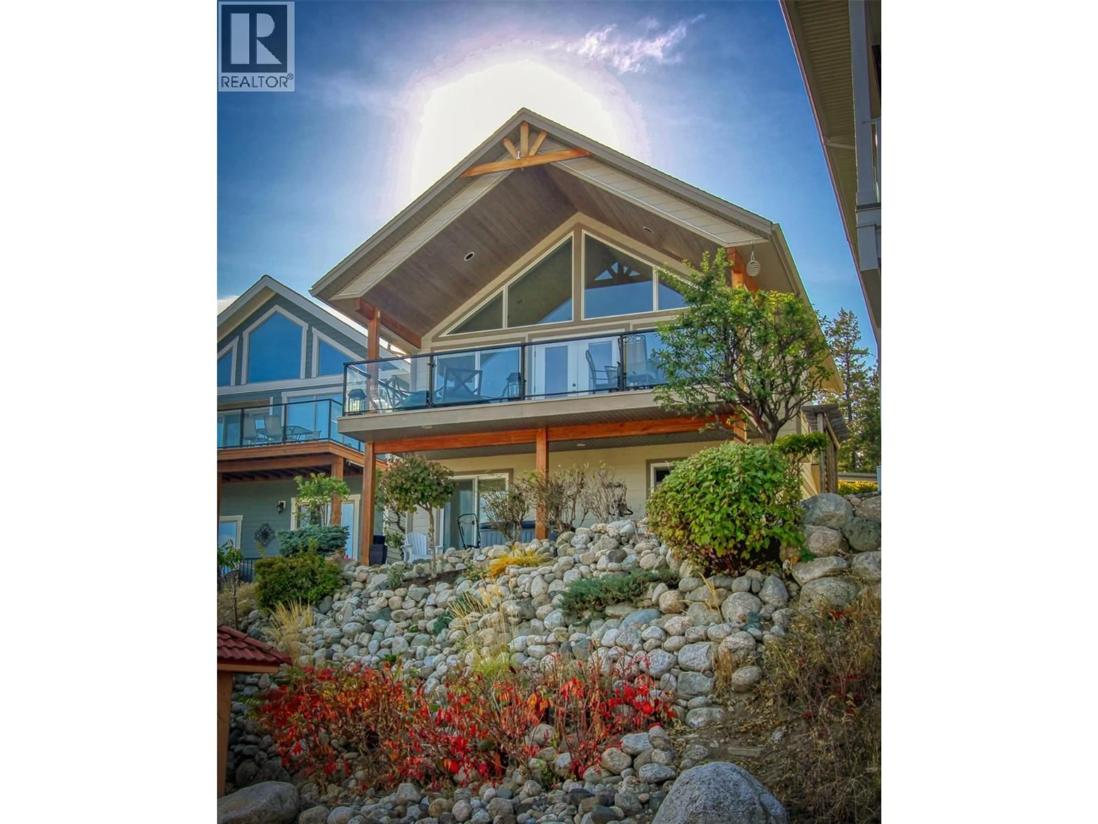 A pic from outside/outdoor area/front of a property/back of a property/a pic from drone, water/lake/river/ocean view for 440 - 6969 TERAZONA DRIVE, Kelowna British Columbia V1Z3R8