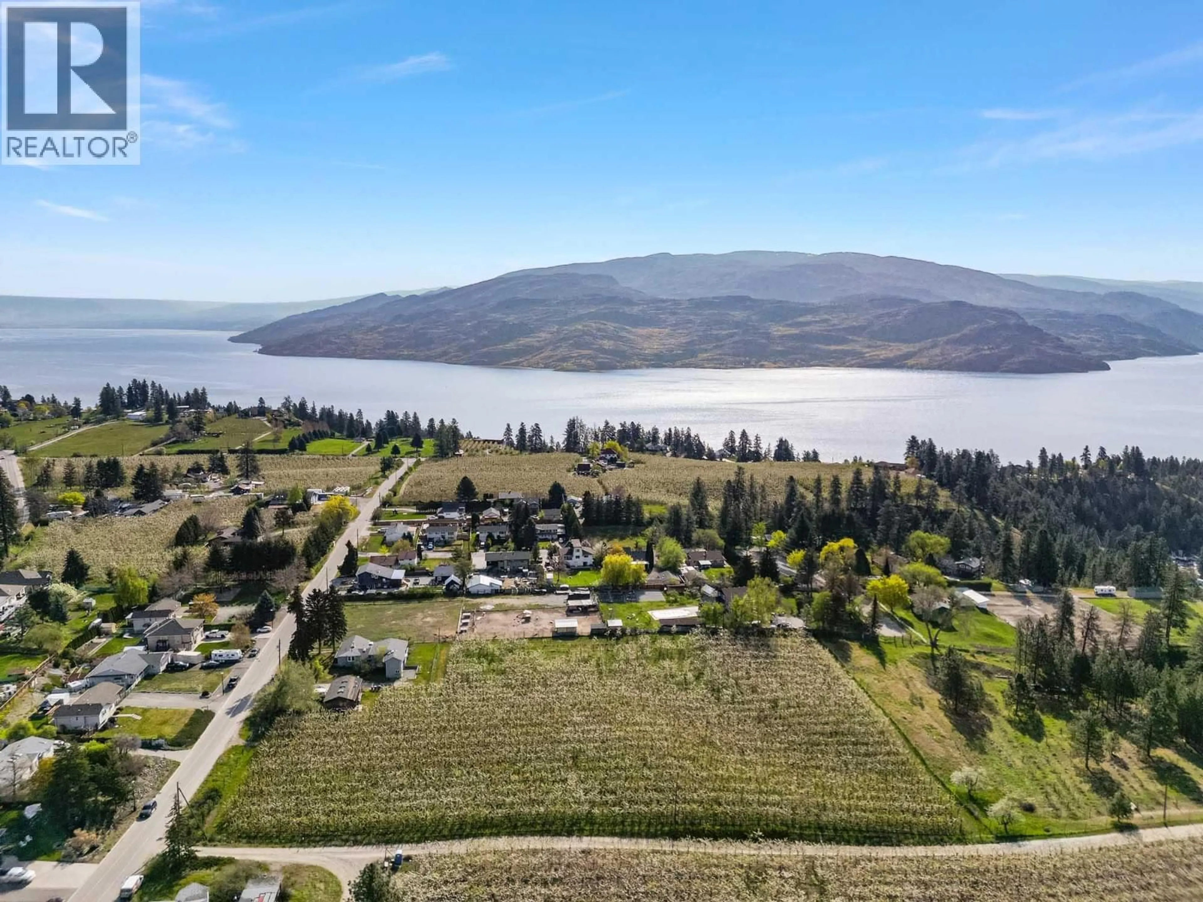 A pic from outside/outdoor area/front of a property/back of a property/a pic from drone, water/lake/river/ocean view for 5028 ELLIOTT AVENUE, Peachland British Columbia V0H1X8