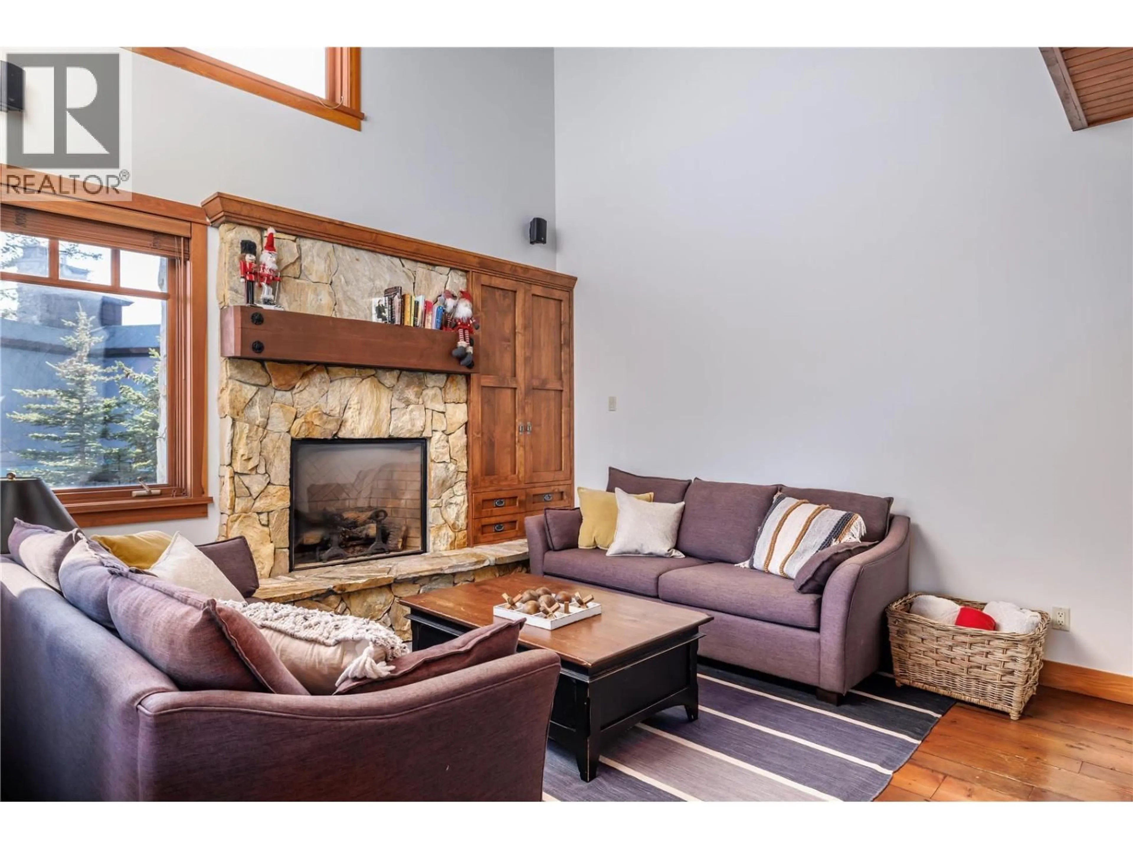 Living room with furniture, wood/laminate floor for 372 ROCKRIDGE ROAD, Big White British Columbia V1P1P3