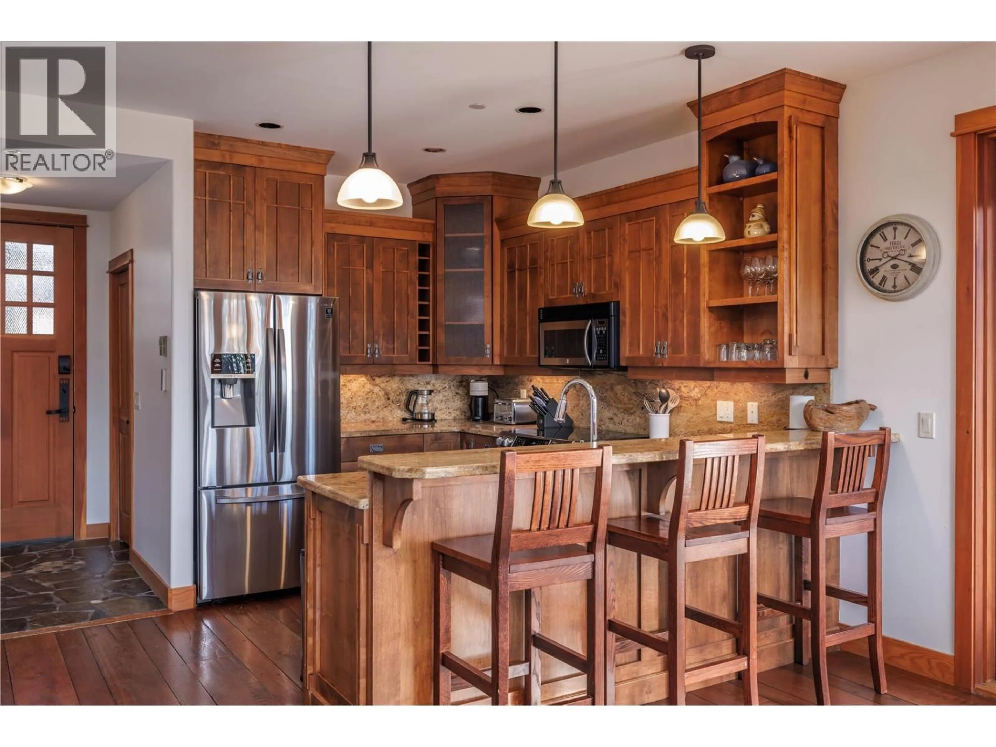 Open concept kitchen, wood/laminate floor for 372 ROCKRIDGE ROAD, Big White British Columbia V1P1P3