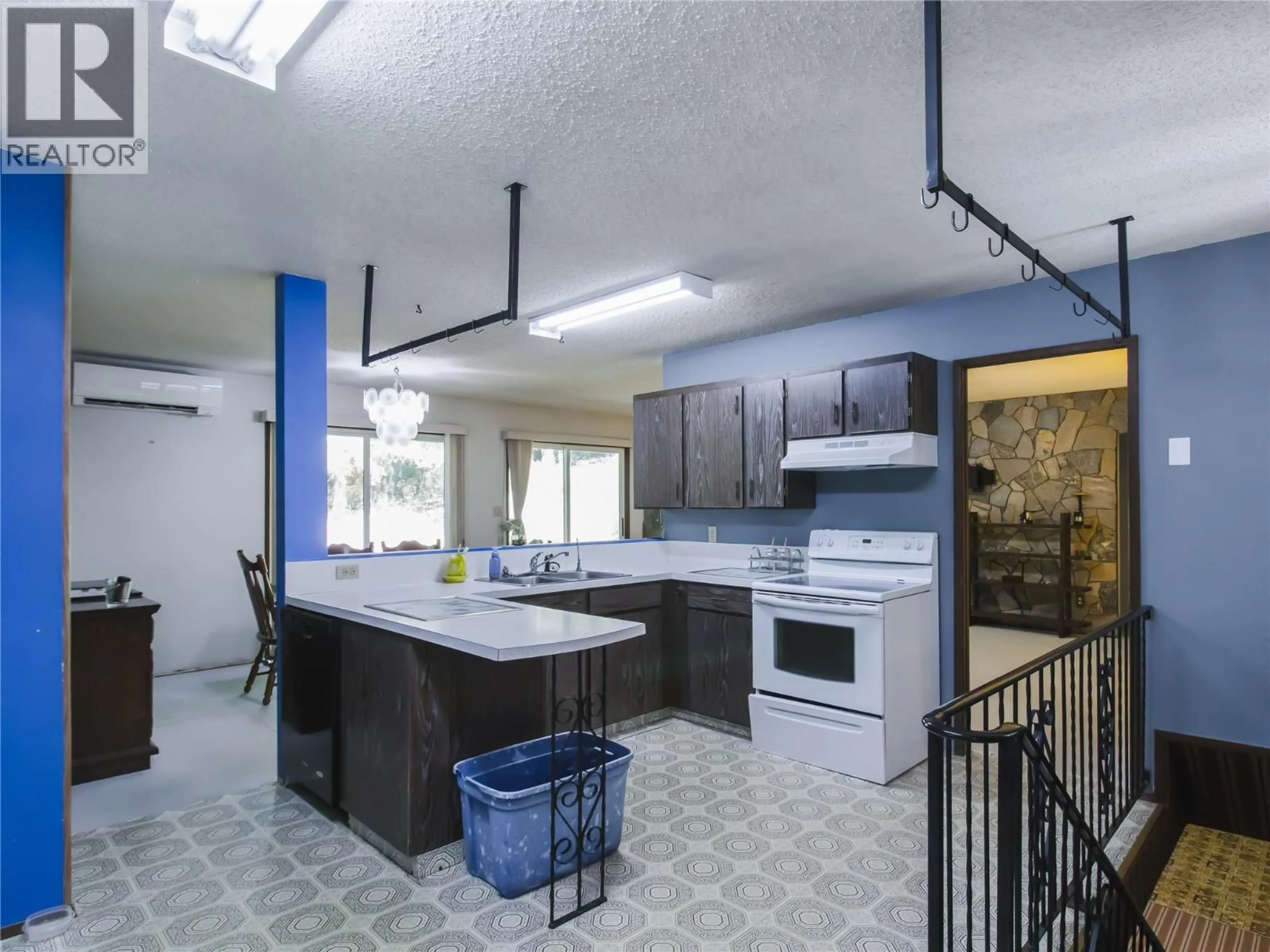 Open concept kitchen, ceramic/tile floor for 8043 97A HIGHWAY, Mara British Columbia V0E2K0