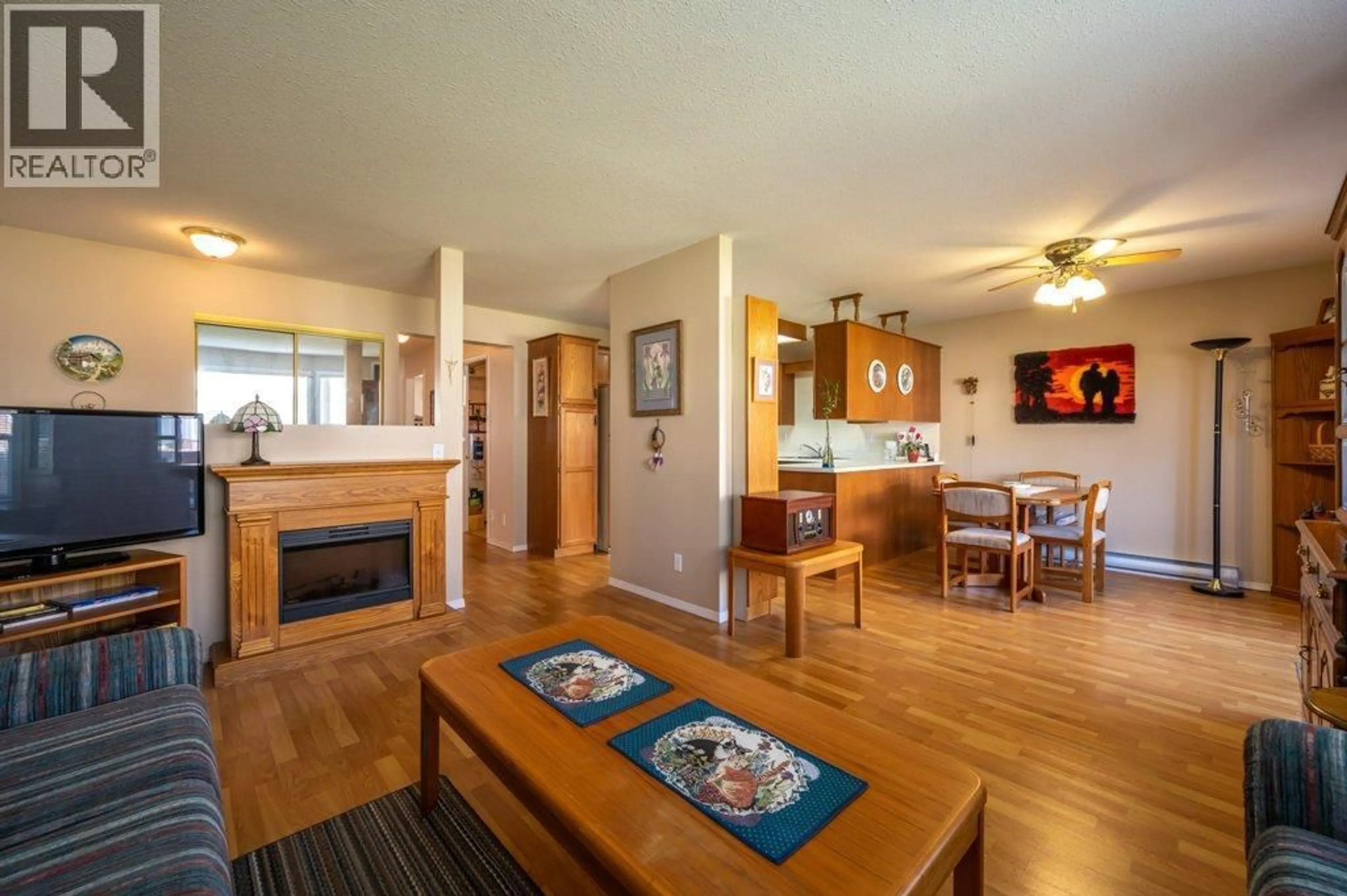 Open concept kitchen, wood/laminate floor for 103 - 13014 ARMSTRONG AVENUE, Summerland British Columbia V0H1Z0