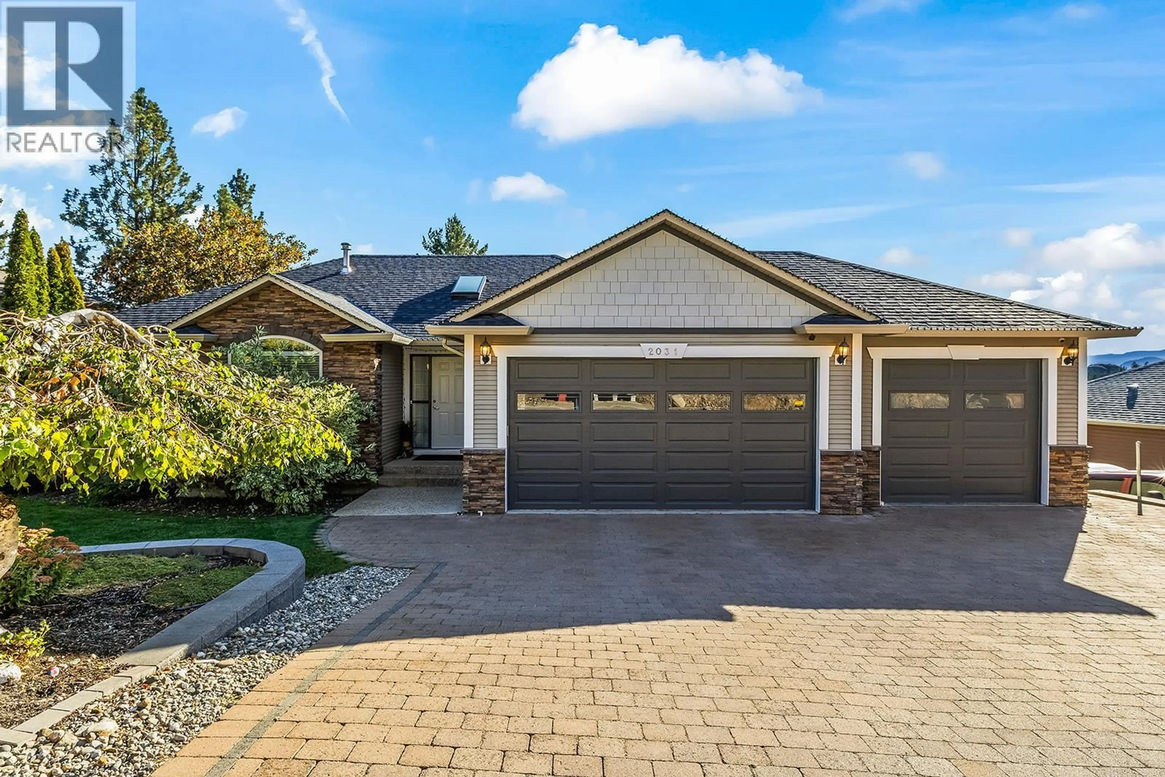Home with brick exterior material, street for 2031 ROSEALEE LANE, West Kelowna British Columbia V1Z3Z5