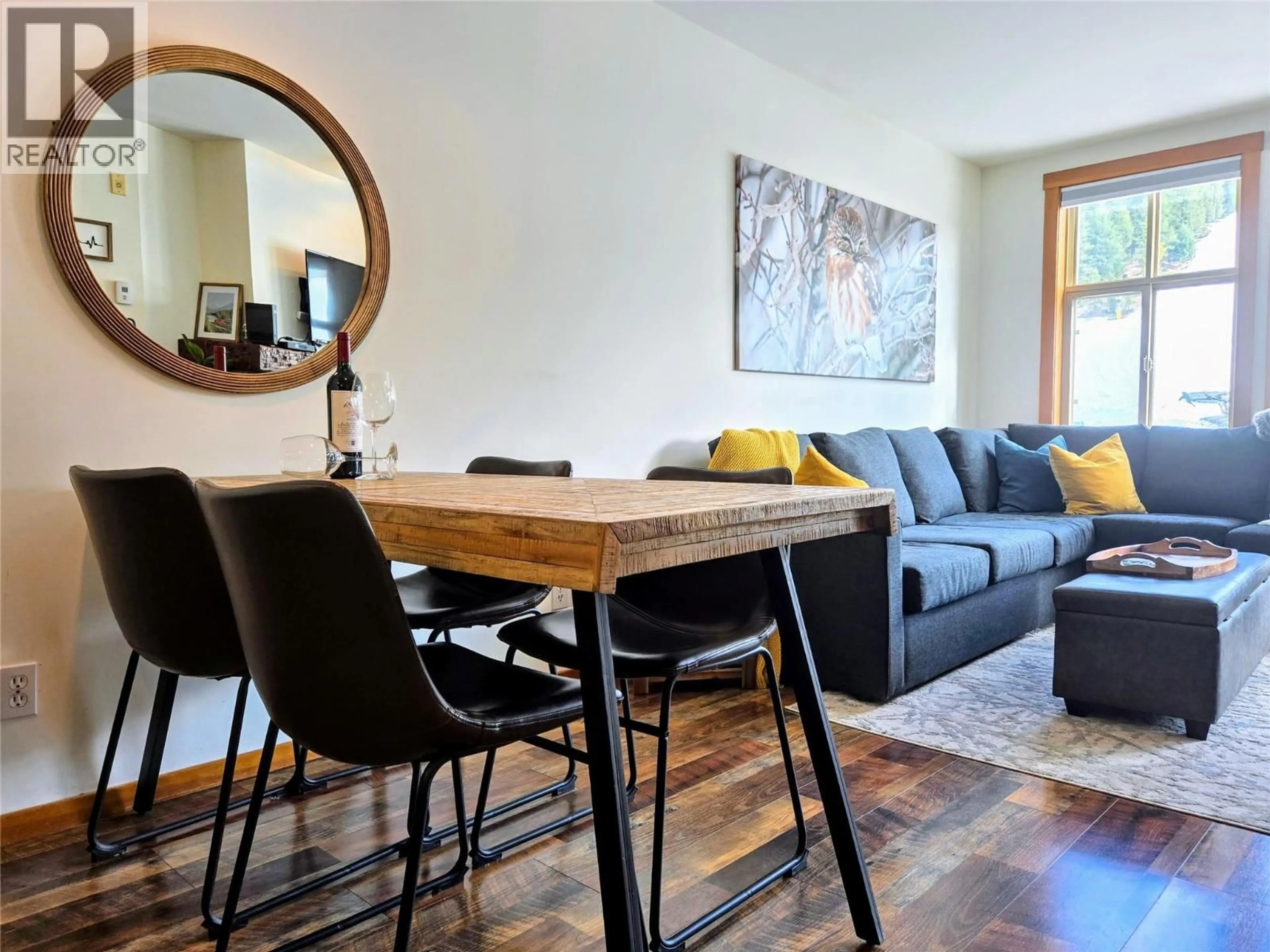 Living room with furniture, wood/laminate floor for 201 - 2050 SUMMIT DRIVE, Panorama British Columbia V0A1T0