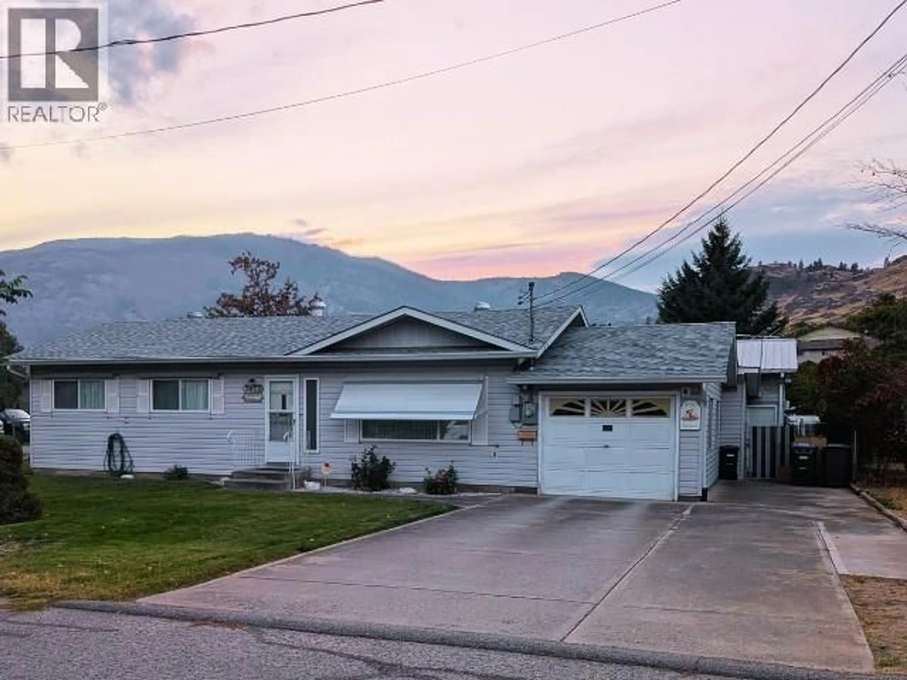 Home with vinyl exterior material, mountain view for 5828 COLUMBIA STREET, Oliver British Columbia V0H1T0