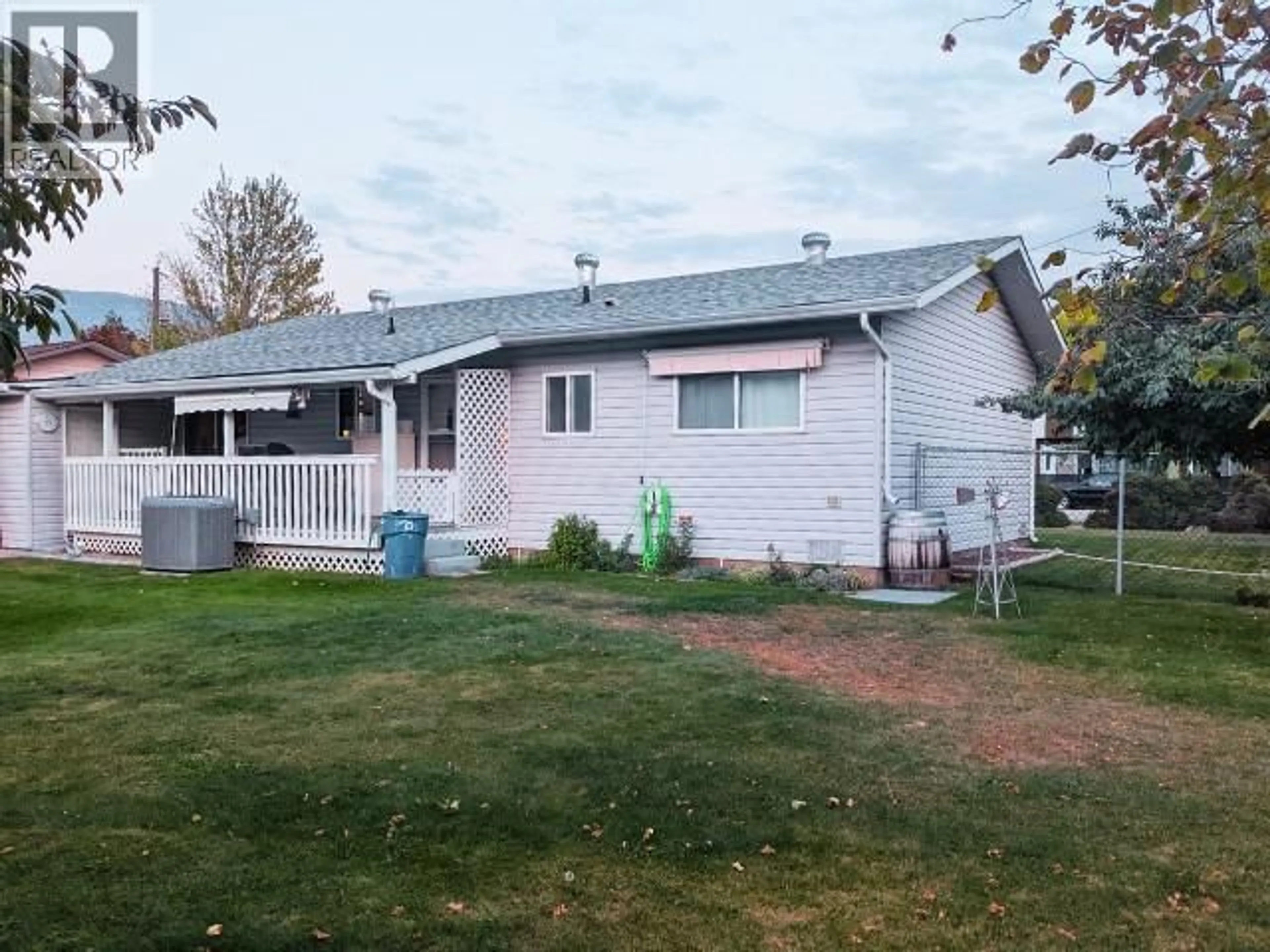 Home with vinyl exterior material, street for 5828 COLUMBIA STREET, Oliver British Columbia V0H1T0