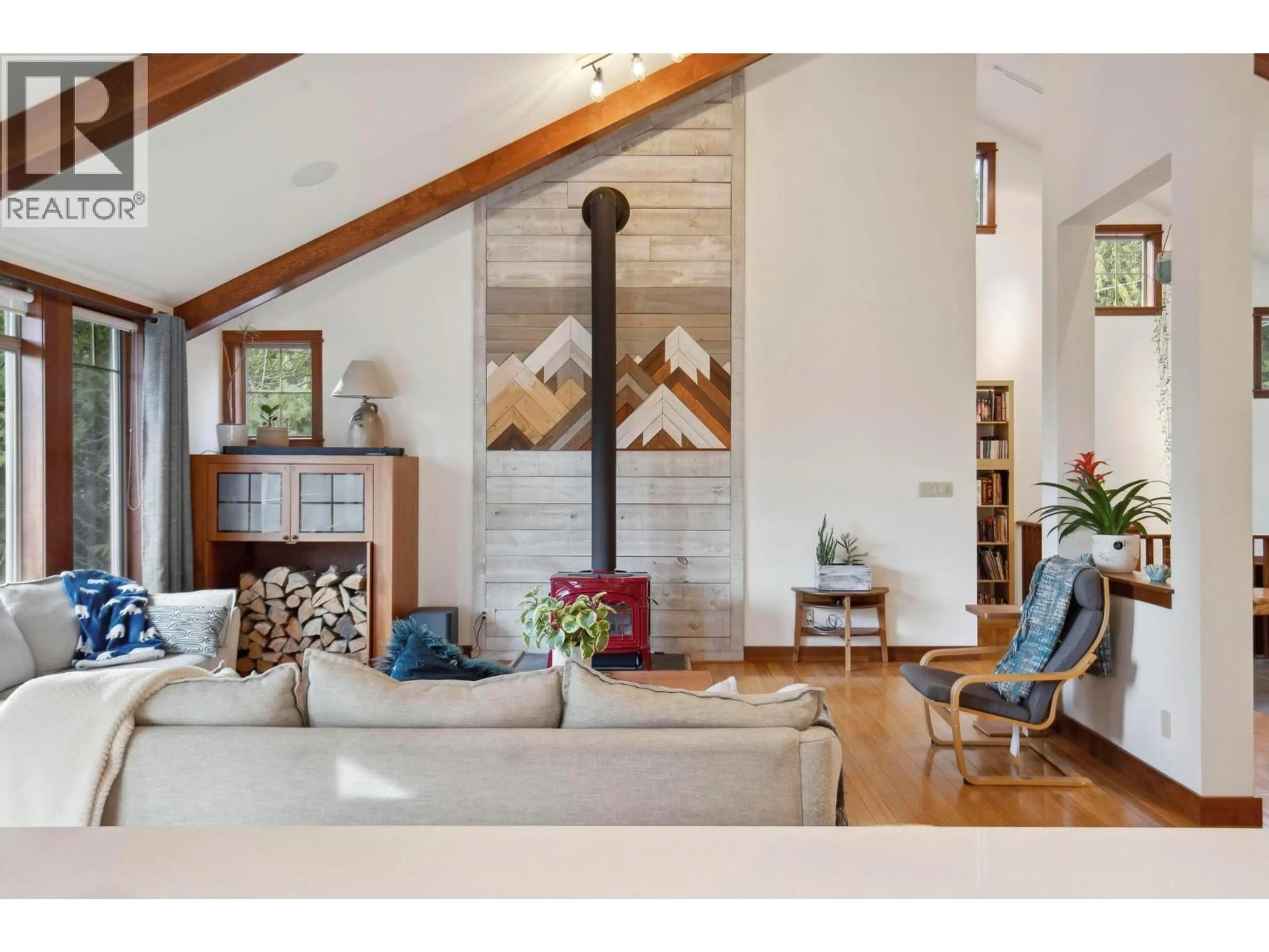 Living room with furniture, wood/laminate floor for 8028 JACKPINE ROAD, Vernon British Columbia V1B3M9
