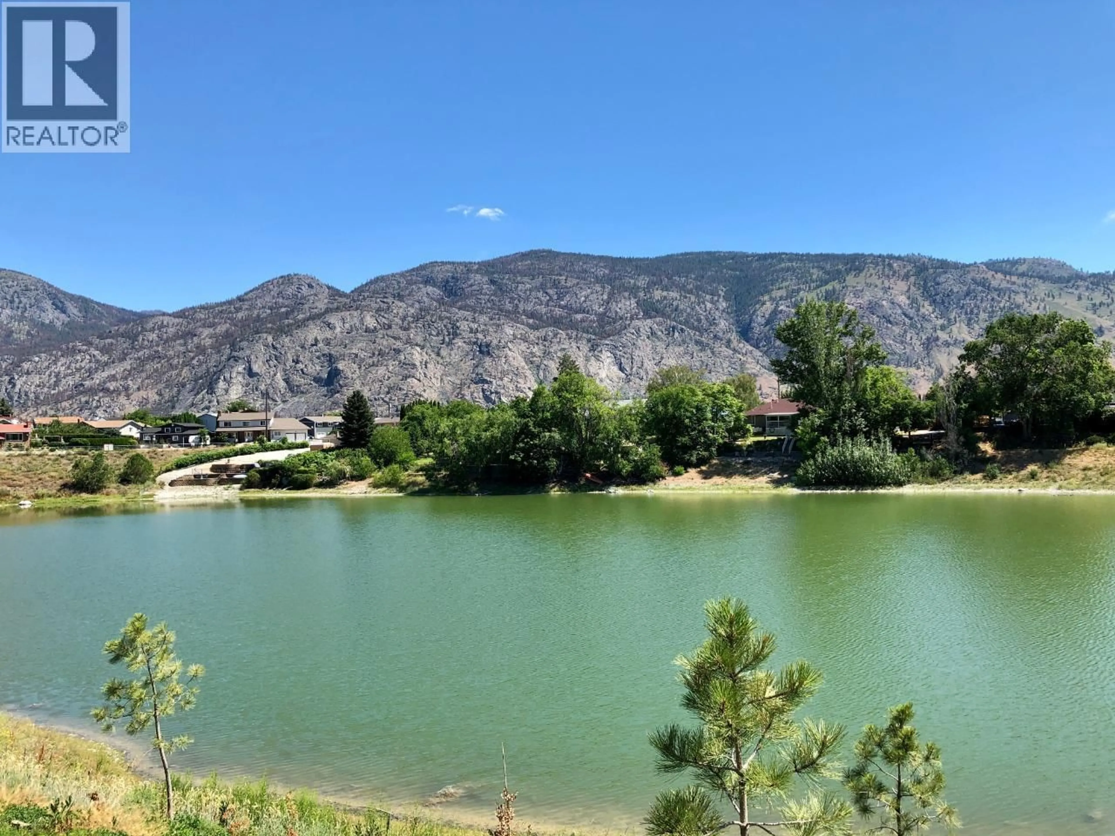 A pic from outside/outdoor area/front of a property/back of a property/a pic from drone, water/lake/river/ocean view for 5 - 8000 VEDETTE DRIVE, Osoyoos British Columbia V0H1V2
