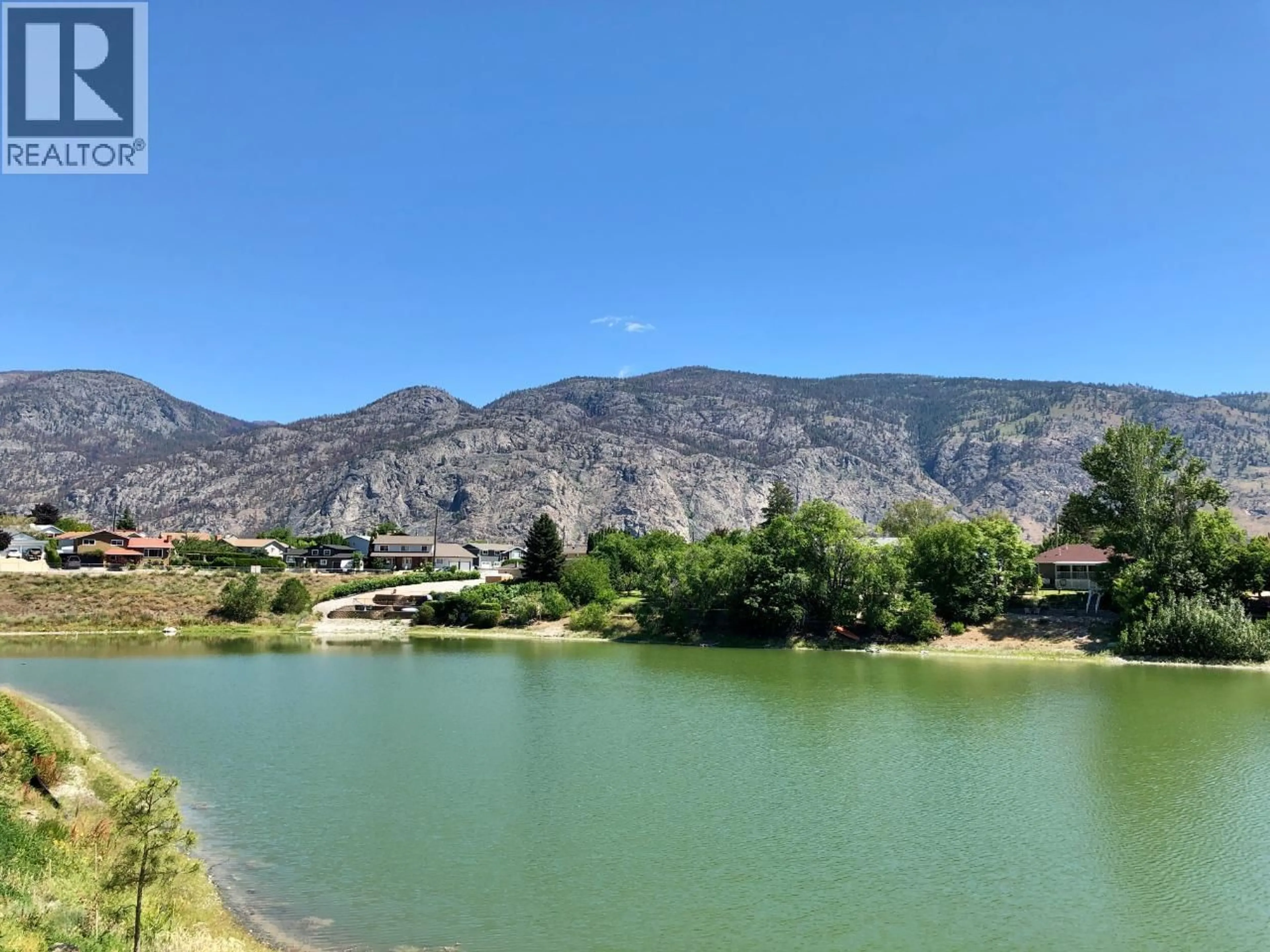 A pic from outside/outdoor area/front of a property/back of a property/a pic from drone, water/lake/river/ocean view for 5 - 8000 VEDETTE DRIVE, Osoyoos British Columbia V0H1V2