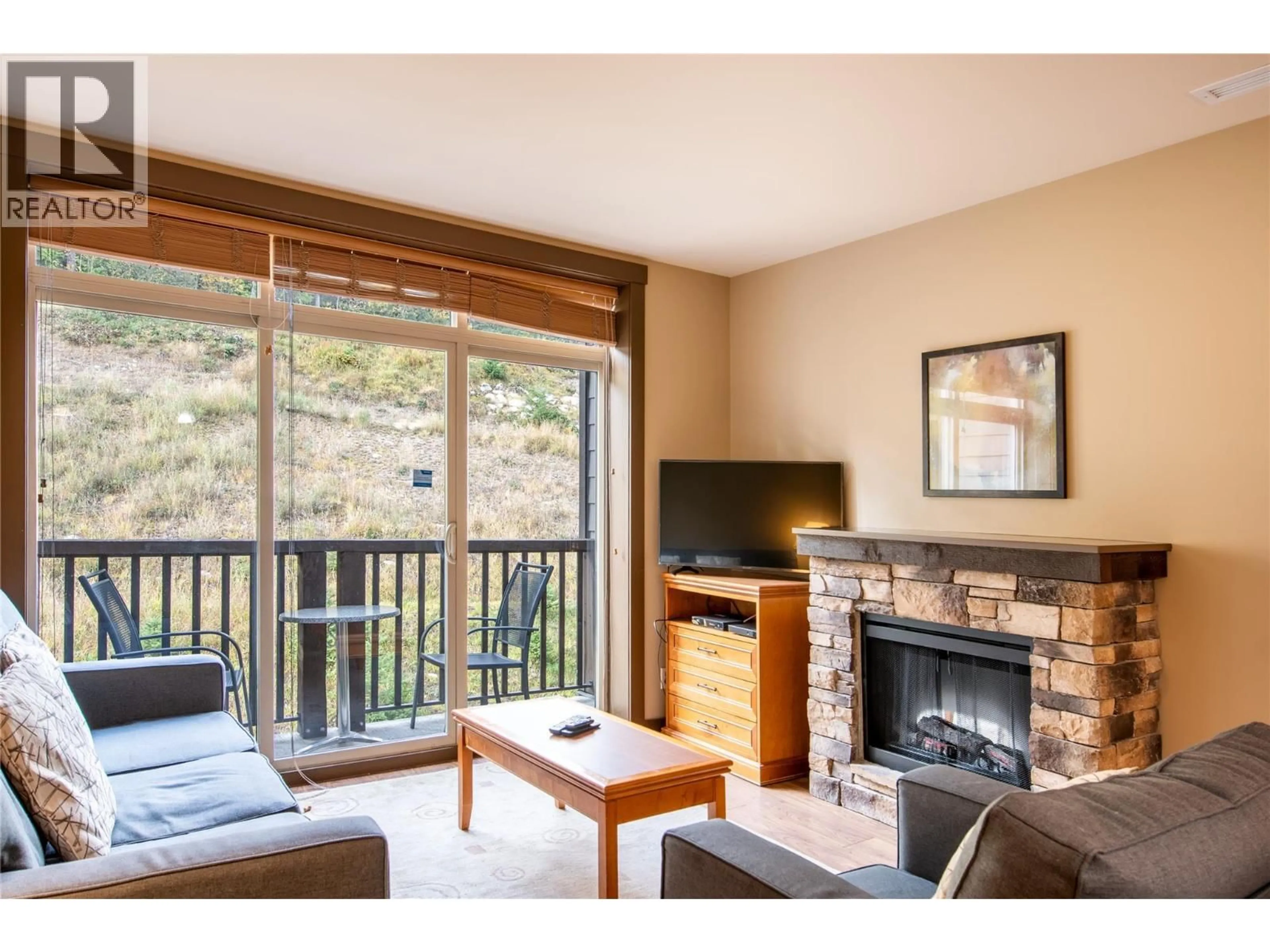 Living room with furniture, wood/laminate floor for 304 - 1420 PALLISER TRAIL, Golden British Columbia V0A1H0