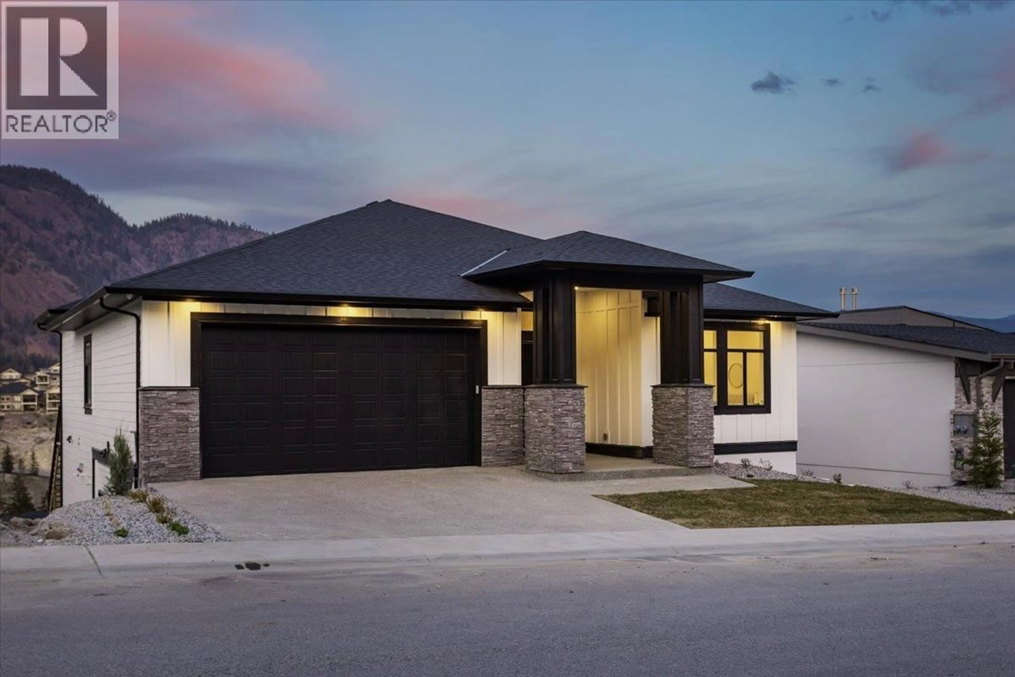 Home with brick exterior material, street for 913 CARNOUSTIE DRIVE, Kelowna British Columbia V1P0A3