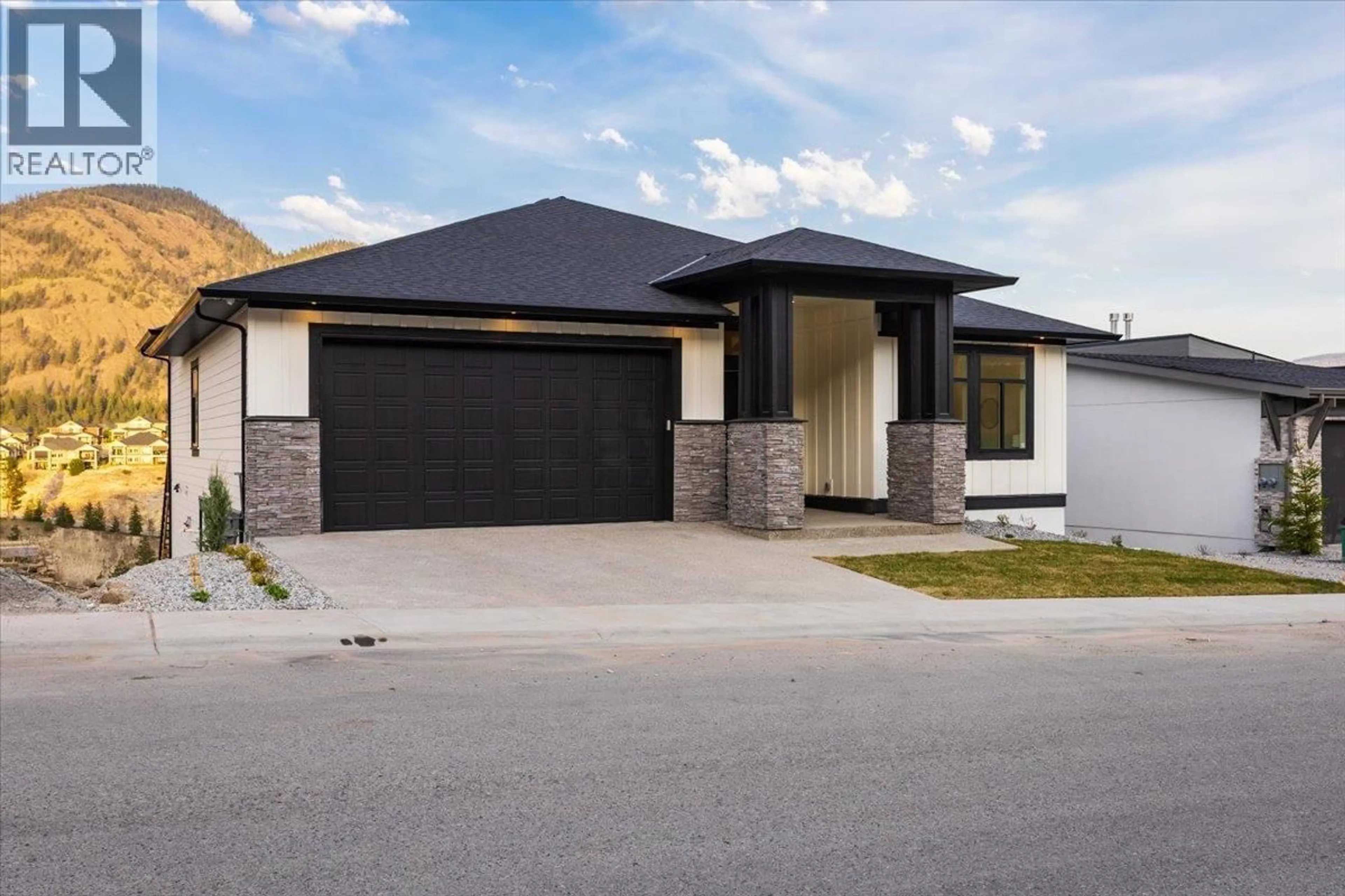 Home with brick exterior material, street for 913 CARNOUSTIE DRIVE, Kelowna British Columbia V1P0A3