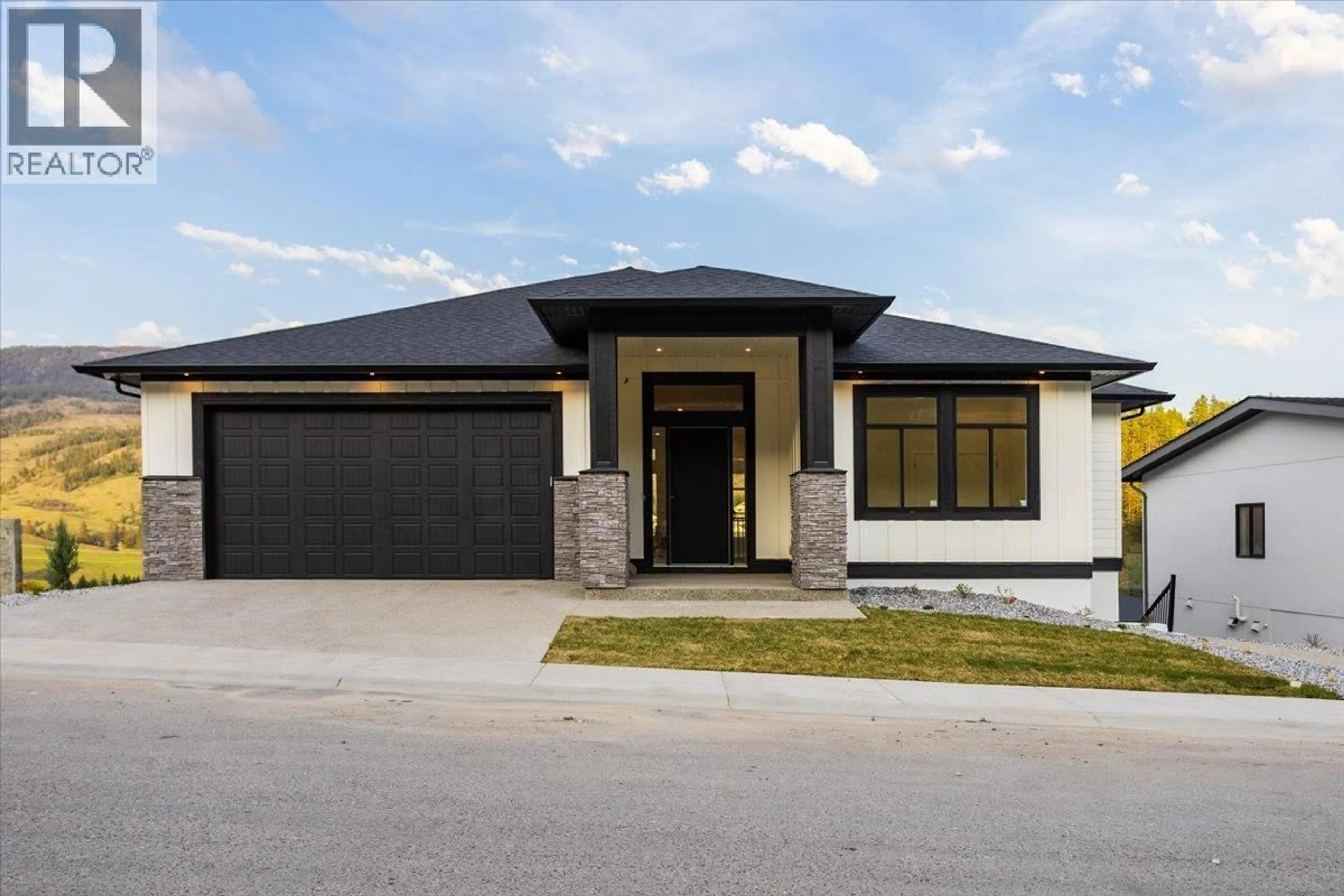 Home with brick exterior material, street for 913 CARNOUSTIE DRIVE, Kelowna British Columbia V1P0A3