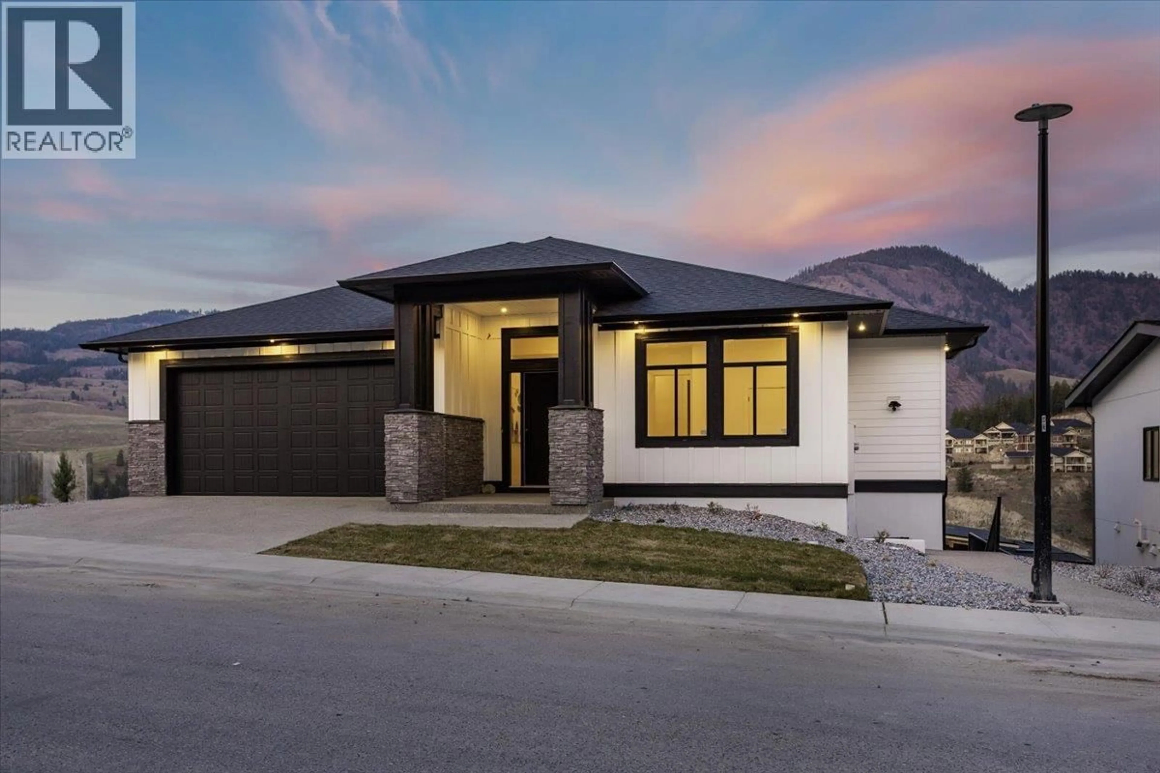 Home with brick exterior material, street for 913 CARNOUSTIE DRIVE, Kelowna British Columbia V1P0A3