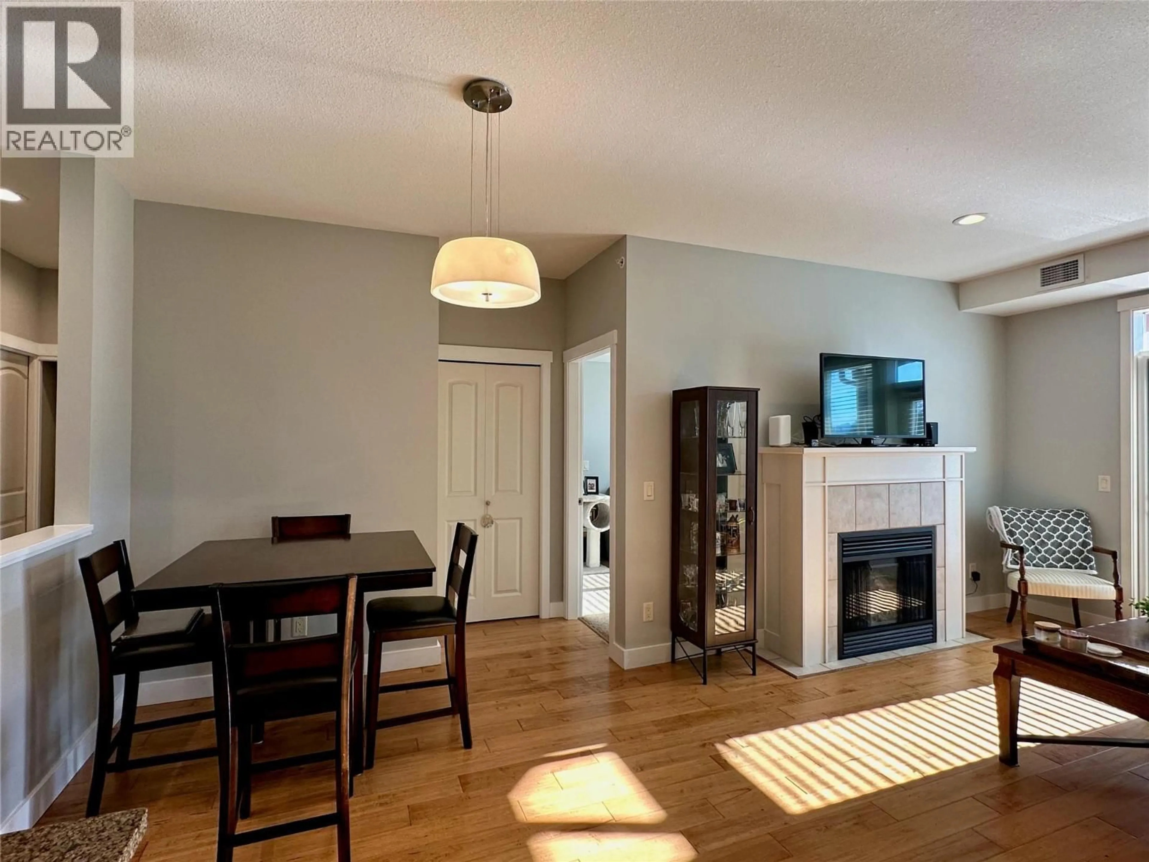 Dining room, wood/laminate floor for 1309 - 2210 UPPER SUNDANCE DRIVE, West Kelowna British Columbia V4T3E9