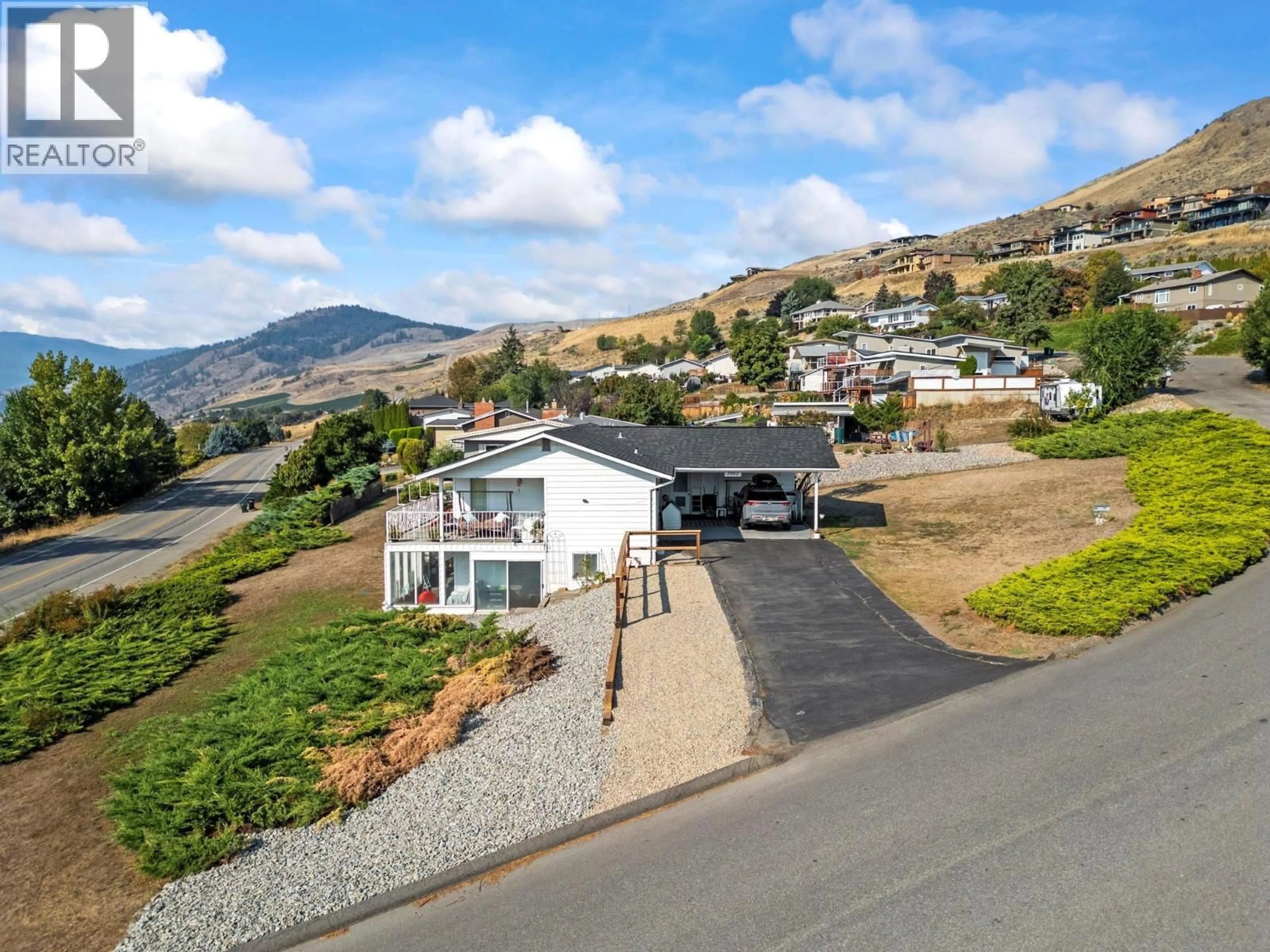 A pic from outside/outdoor area/front of a property/back of a property/a pic from drone, mountain view for 7002 APPALOOSA WAY, Vernon British Columbia V1H1B9