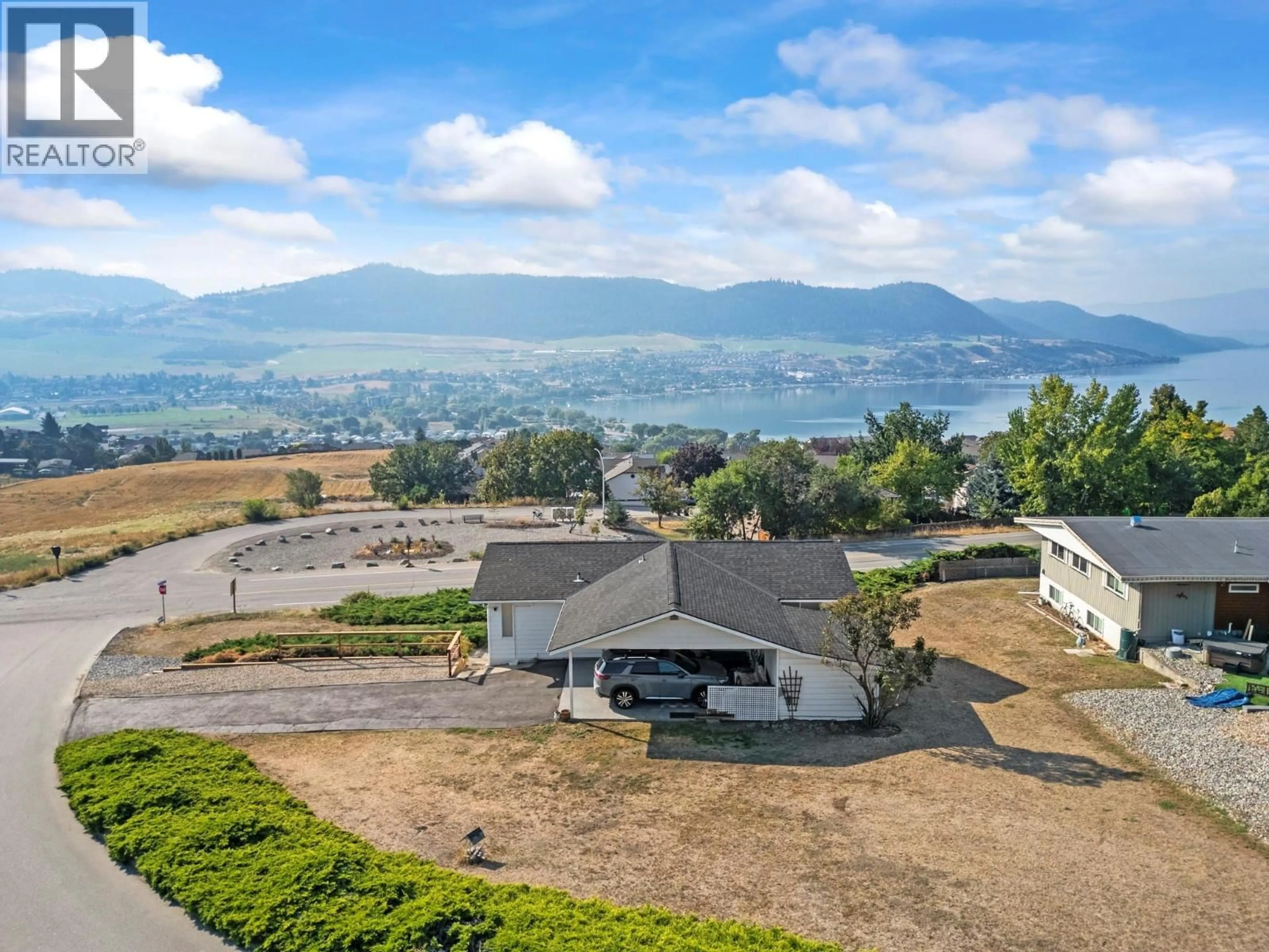 A pic from outside/outdoor area/front of a property/back of a property/a pic from drone, mountain view for 7002 APPALOOSA WAY, Vernon British Columbia V1H1B9