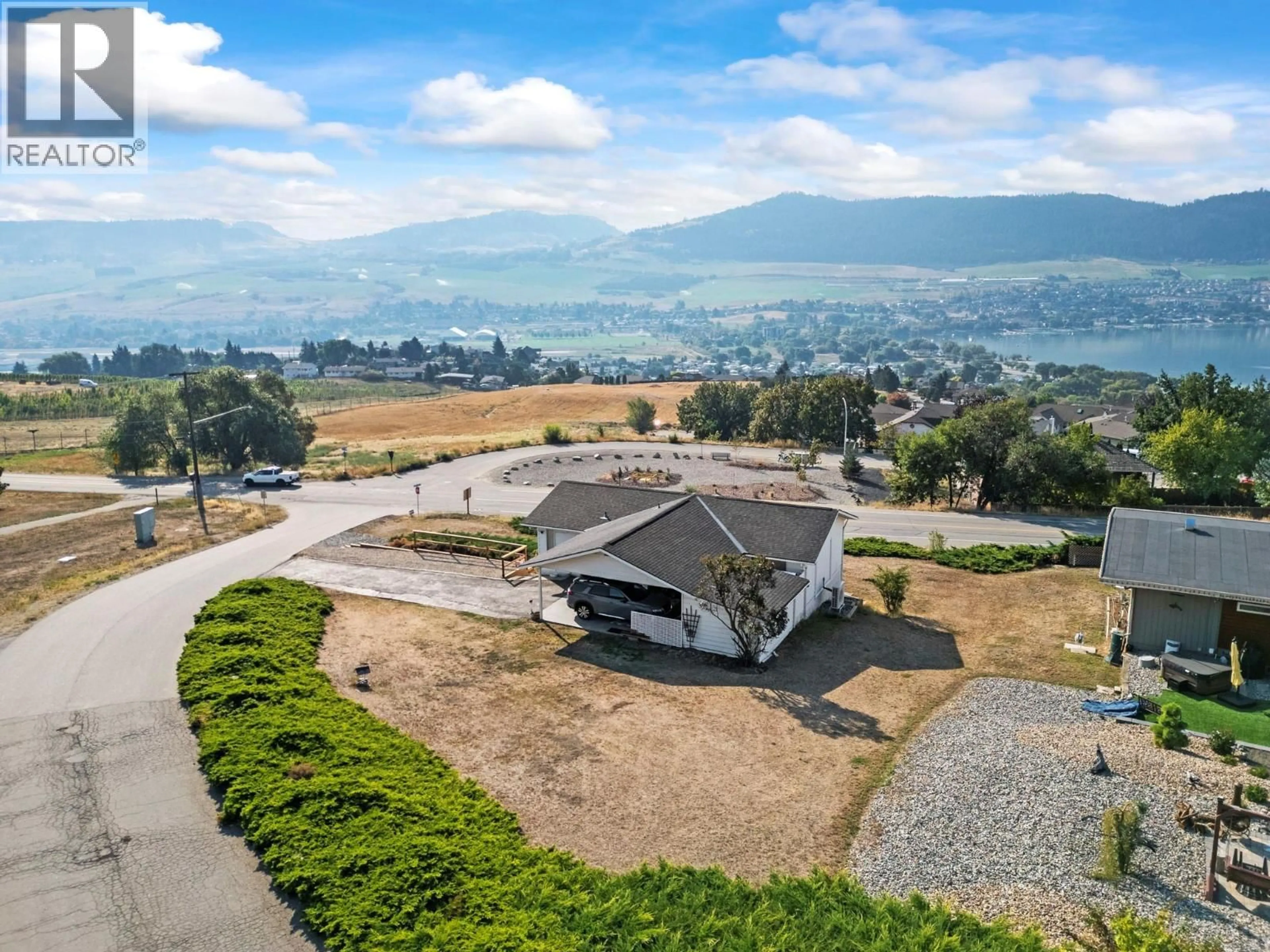A pic from outside/outdoor area/front of a property/back of a property/a pic from drone, mountain view for 7002 APPALOOSA WAY, Vernon British Columbia V1H1B9
