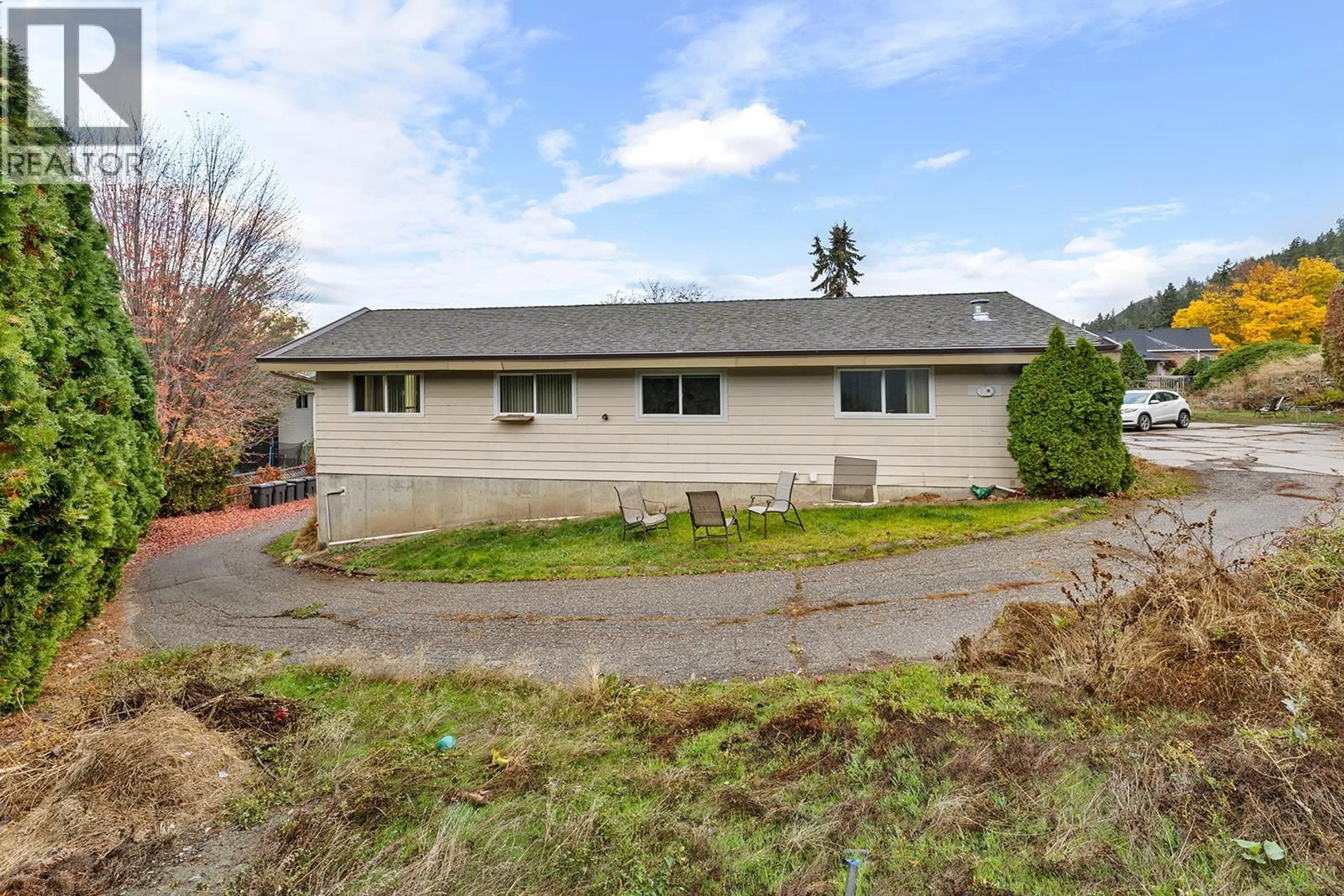 A pic from outside/outdoor area/front of a property/back of a property/a pic from drone, street for 154 APPLEBROOKE CRESCENT, Kelowna British Columbia V1V1W4