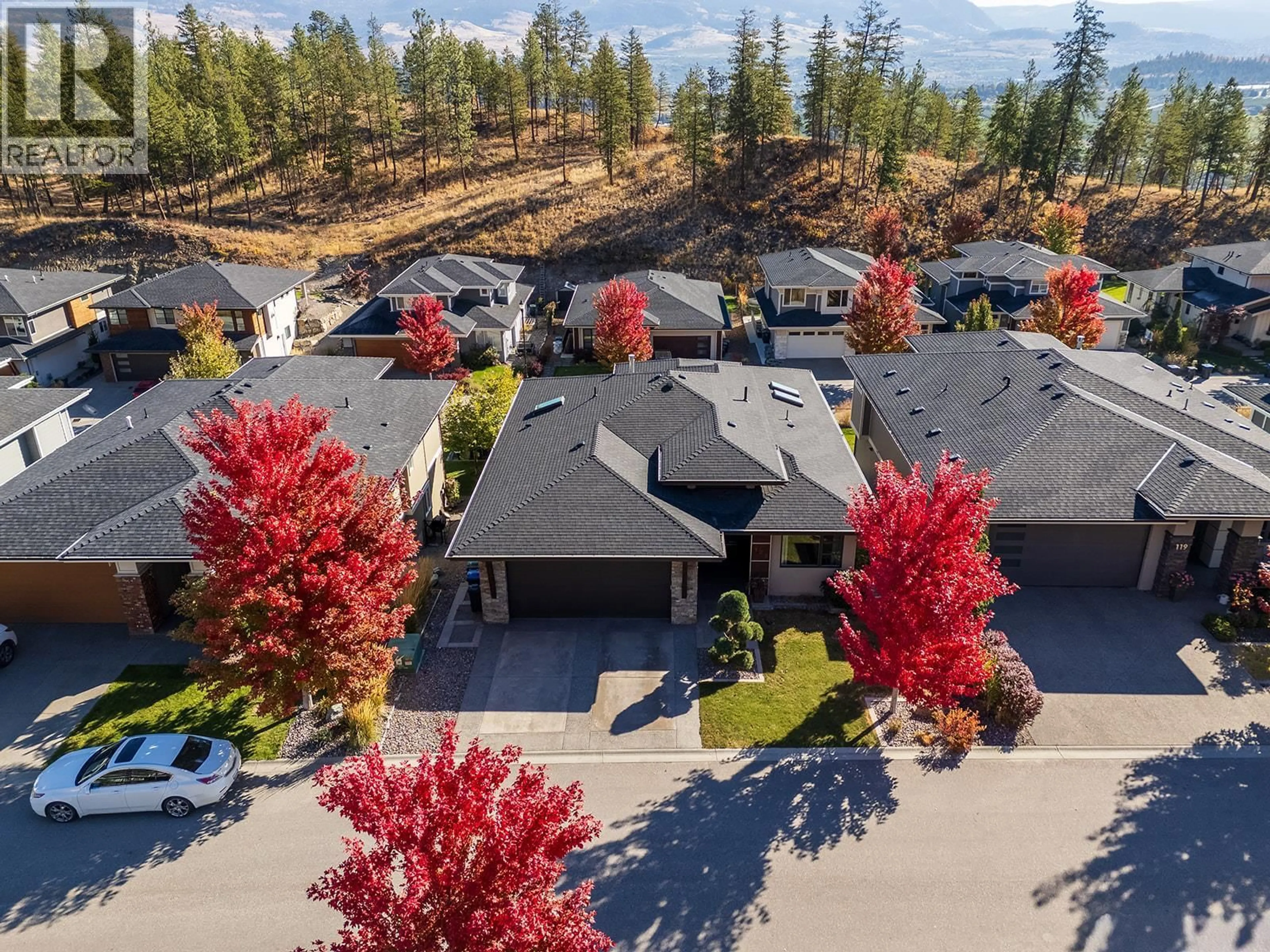 A pic from outside/outdoor area/front of a property/back of a property/a pic from drone, forest/trees view for 123 SPLIT PINE COURT, Kelowna British Columbia V1V3G3