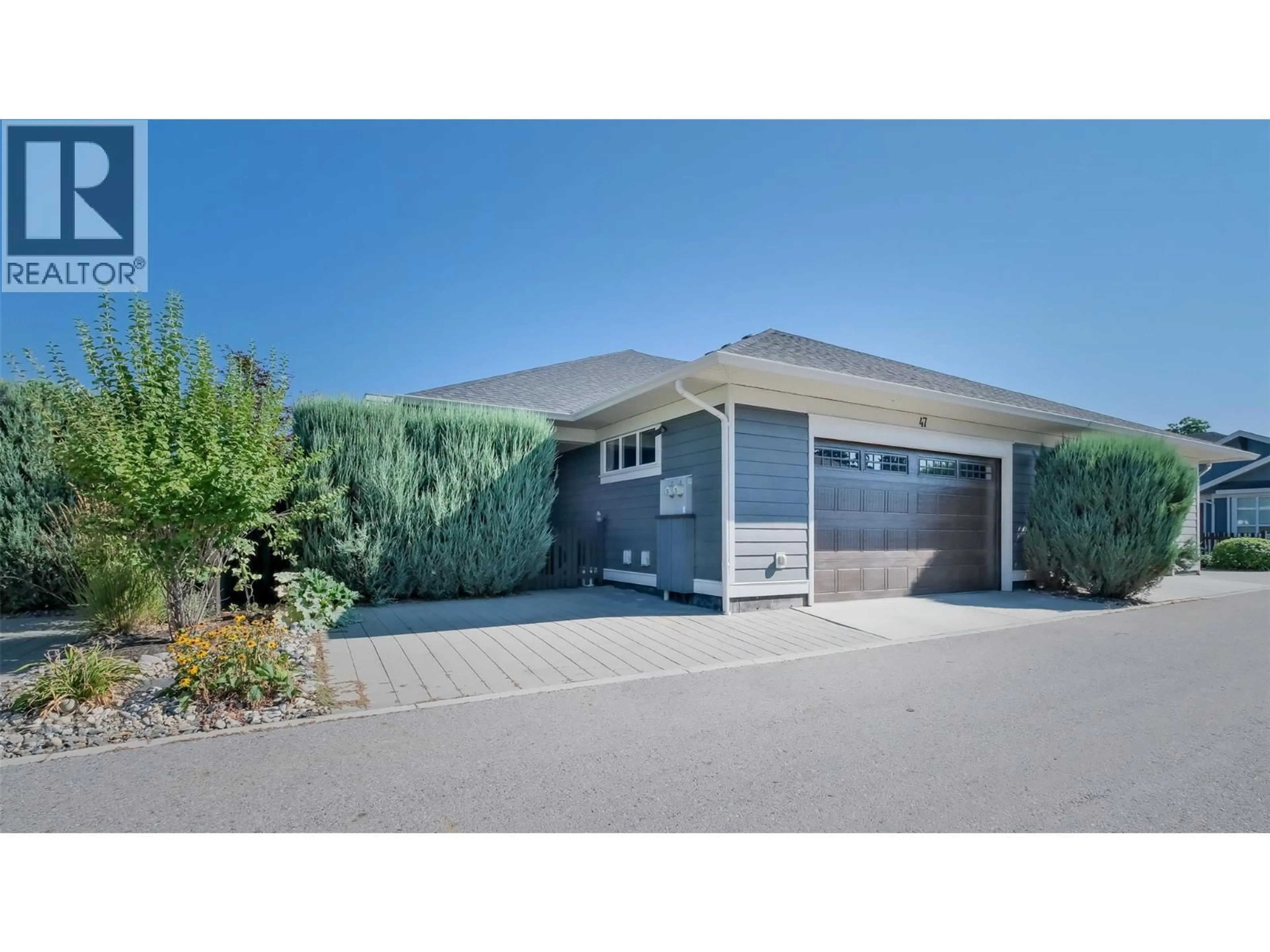 Home with vinyl exterior material, street for 47 - 1960 KLO ROAD, Kelowna British Columbia V1W5L2