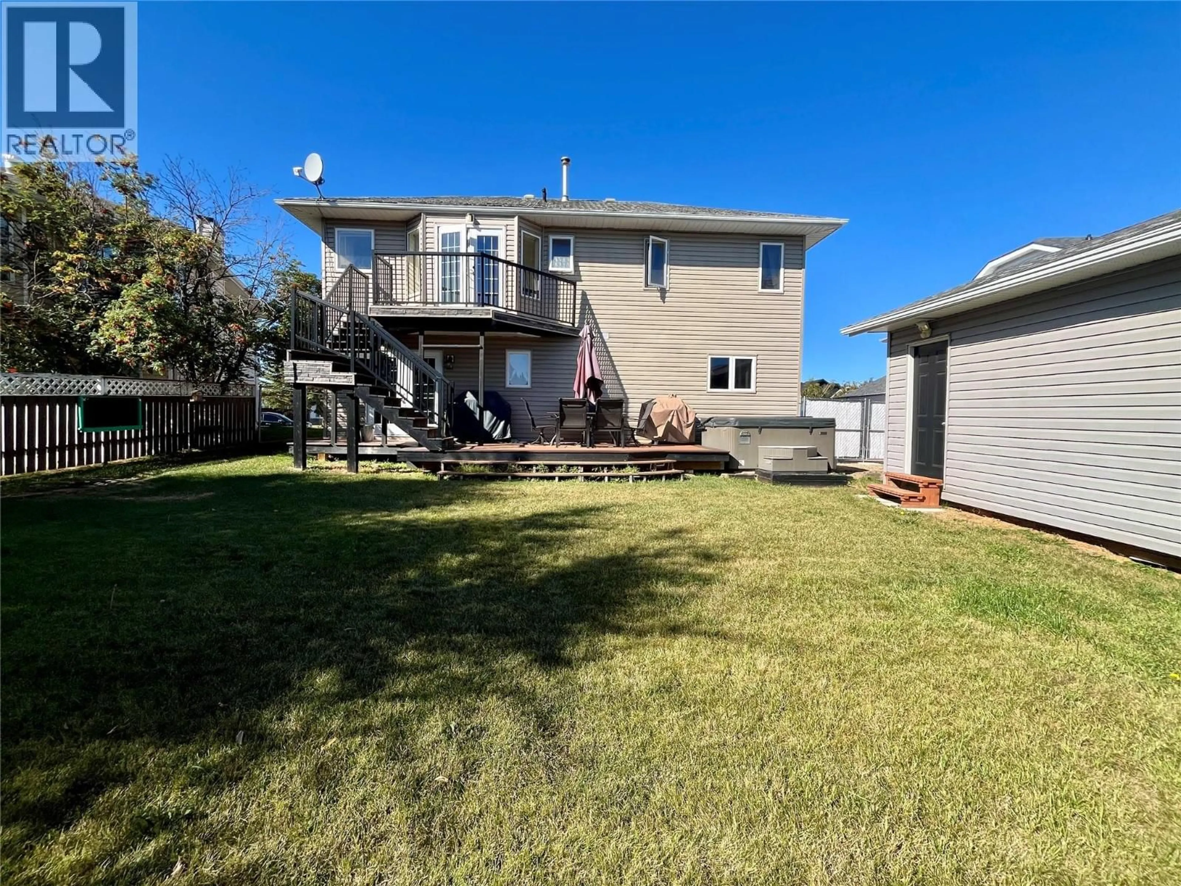 A pic from outside/outdoor area/front of a property/back of a property/a pic from drone, water/lake/river/ocean view for 10710 COTTONWOOD CRESCENT, Dawson Creek British Columbia V1G4M4